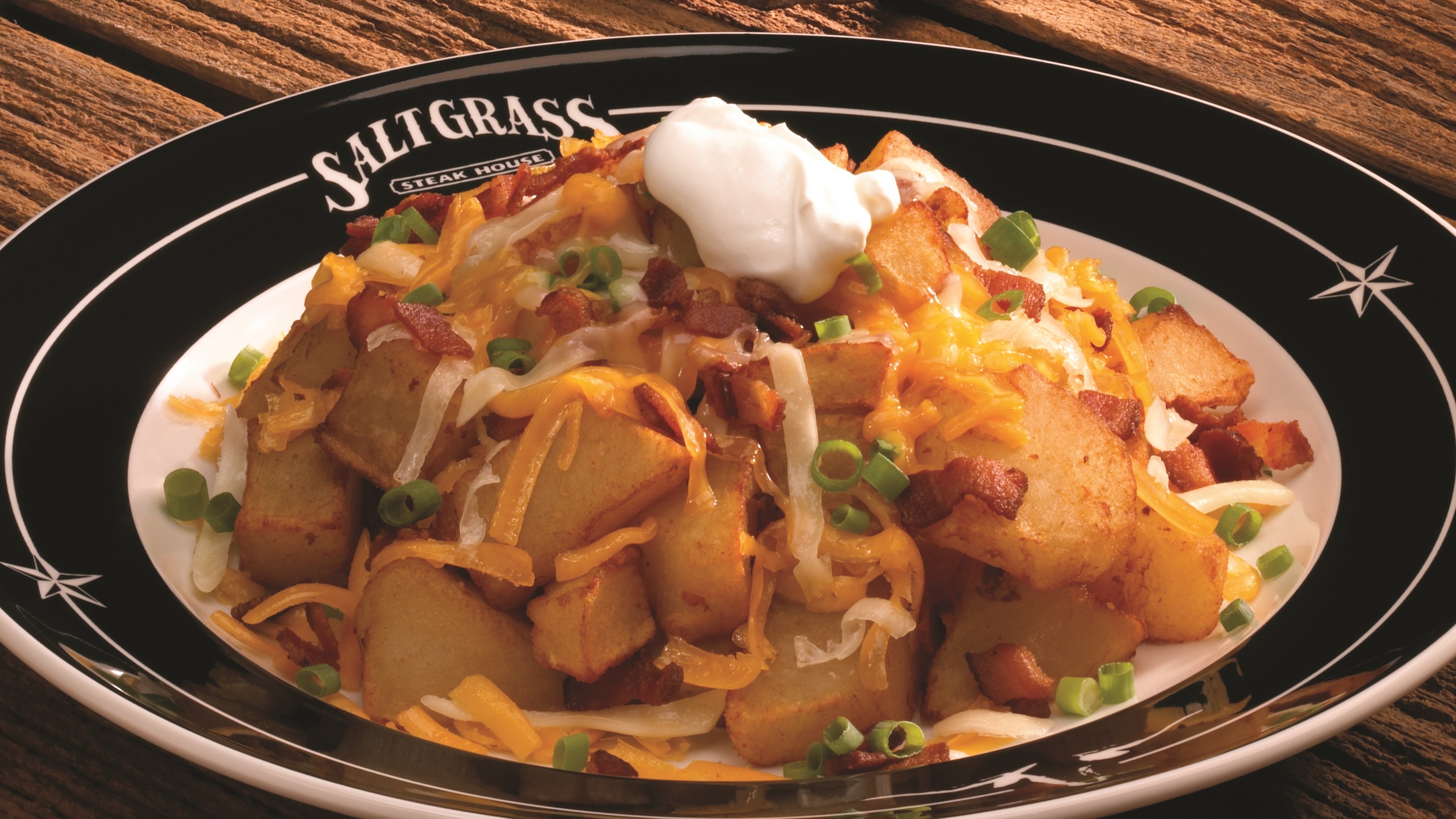 Order Chuck Wagon Cheese Fries food online from Saltgrass Steak House store, Mesquite on bringmethat.com