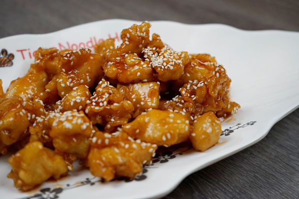 Order Sesame Chicken food online from Tiger Noodle House store, Houston on bringmethat.com
