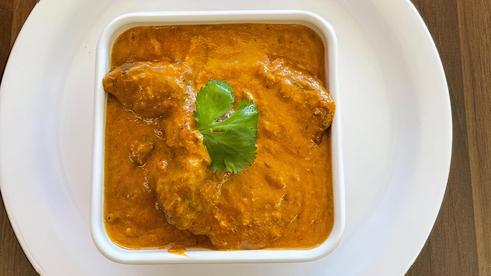 Order Lamb Korma food online from Indian Cafe store, East Moline on bringmethat.com