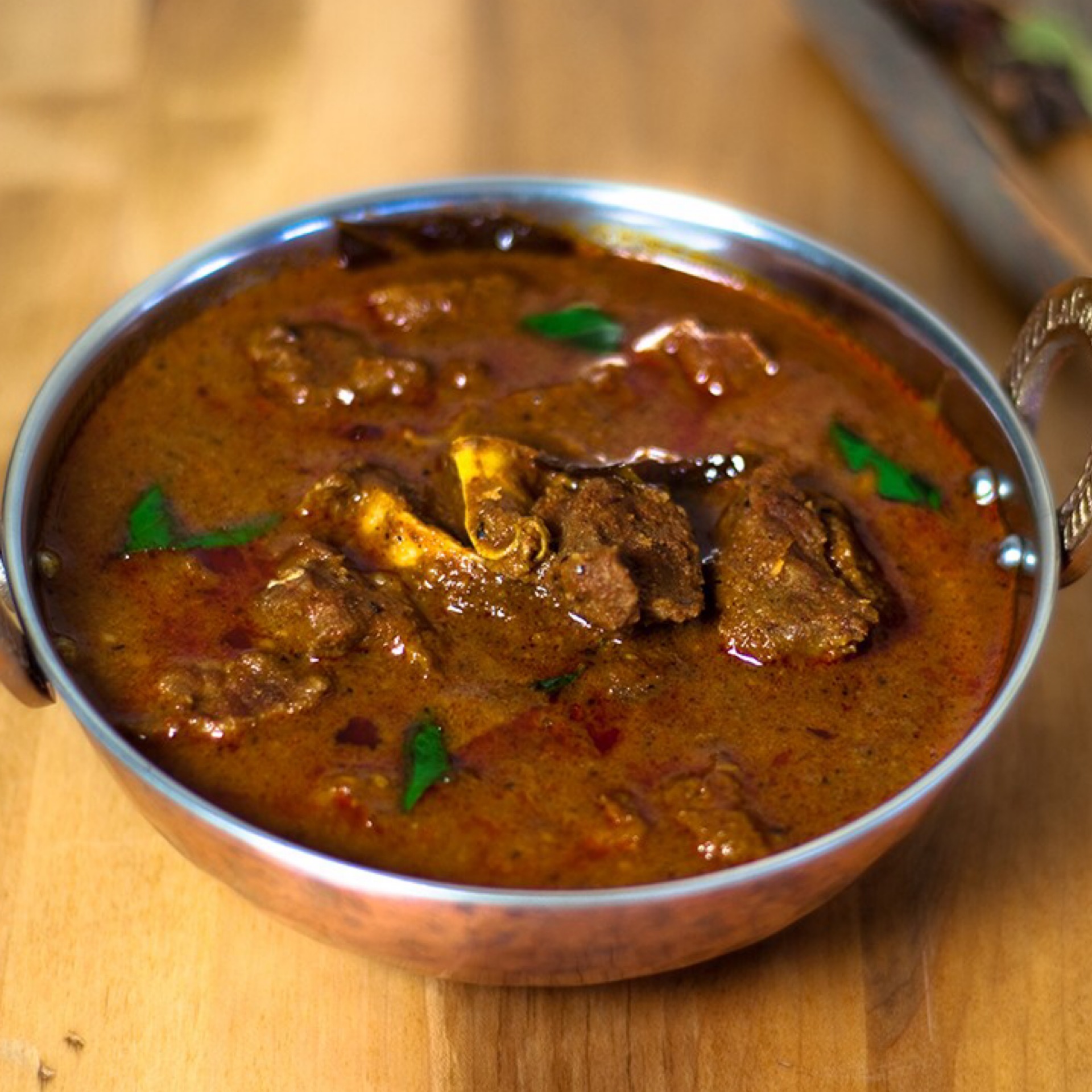 Order Goat Curry food online from MasalaCraft Indian Cuisine store, Santa Ana on bringmethat.com