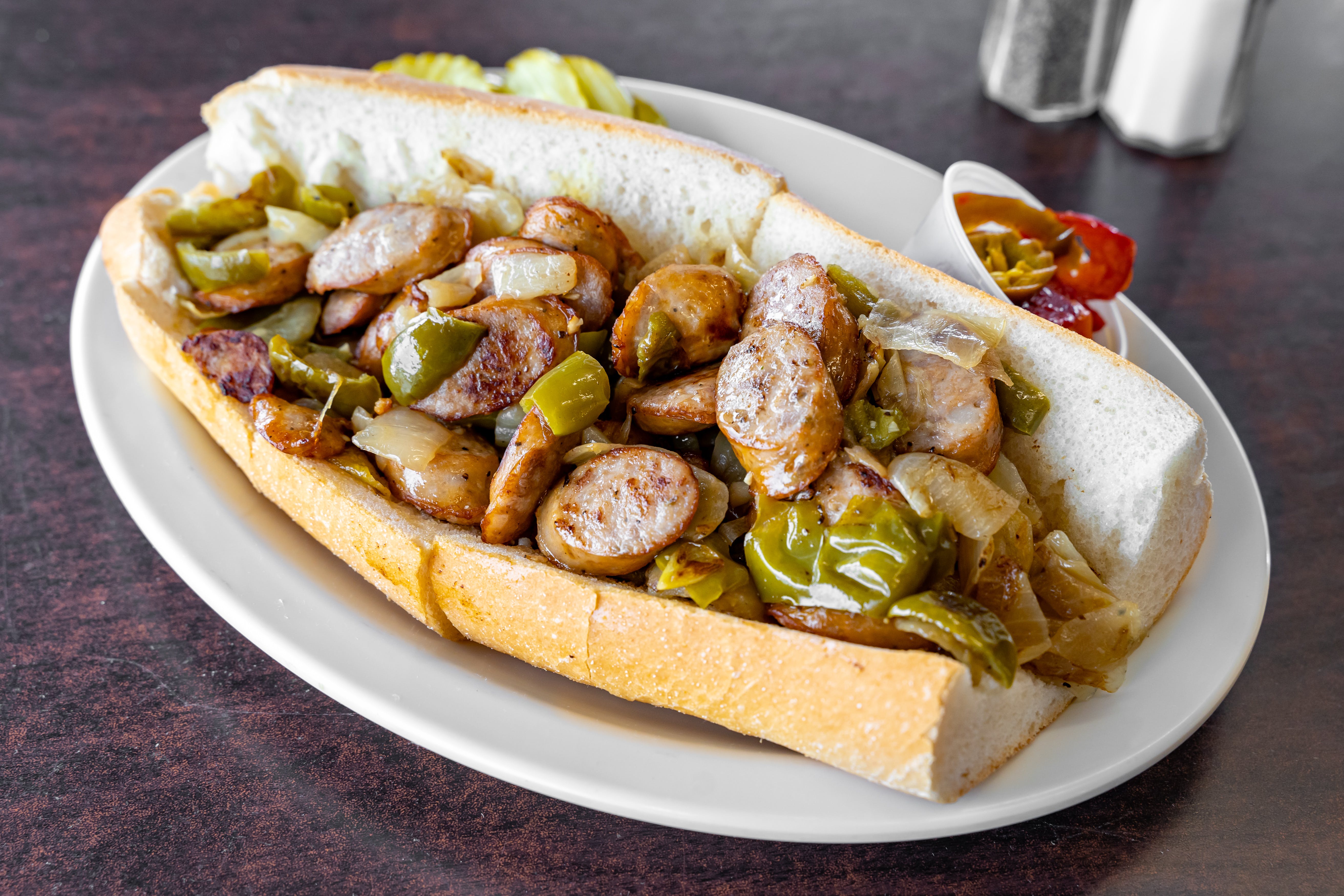 Order Sausage, Green Peppers & Onions Sandwich - Half 10" food online from Steak Out store, Sewell on bringmethat.com
