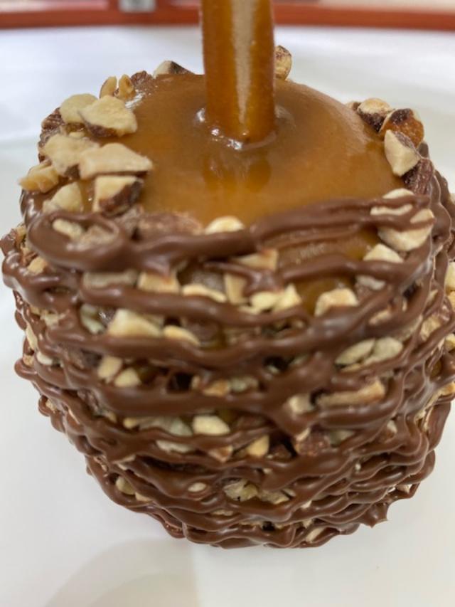 Order Almond Caramel Apple with Milk Chocolate food online from Rocky Mountain Chocolate Factory store, Redondo Beach on bringmethat.com