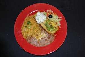 Order A. Chimichanga Chicken, Beef, or Carnitas with Guacamole & Sour Cream food online from Manuel's Mexican store, Phoenix on bringmethat.com