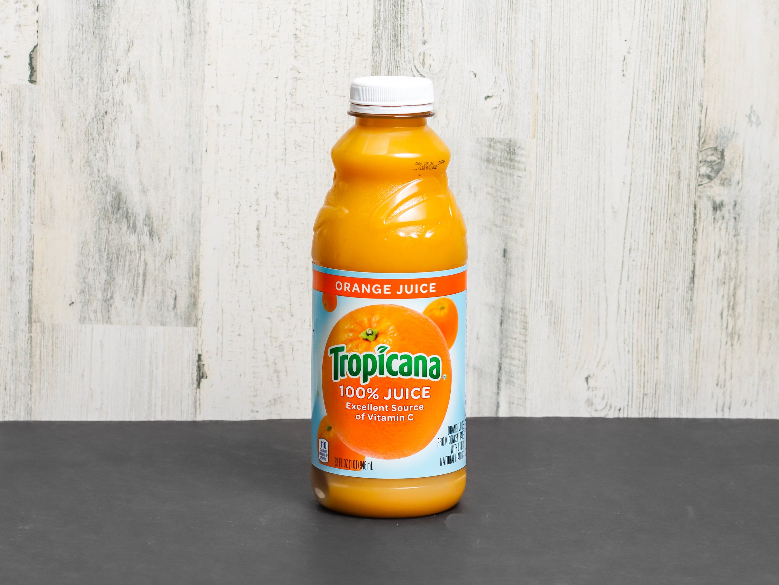 Order 32 oz. Tropicana 100% Orange Juice food online from Greenville Stop store, Dallas on bringmethat.com