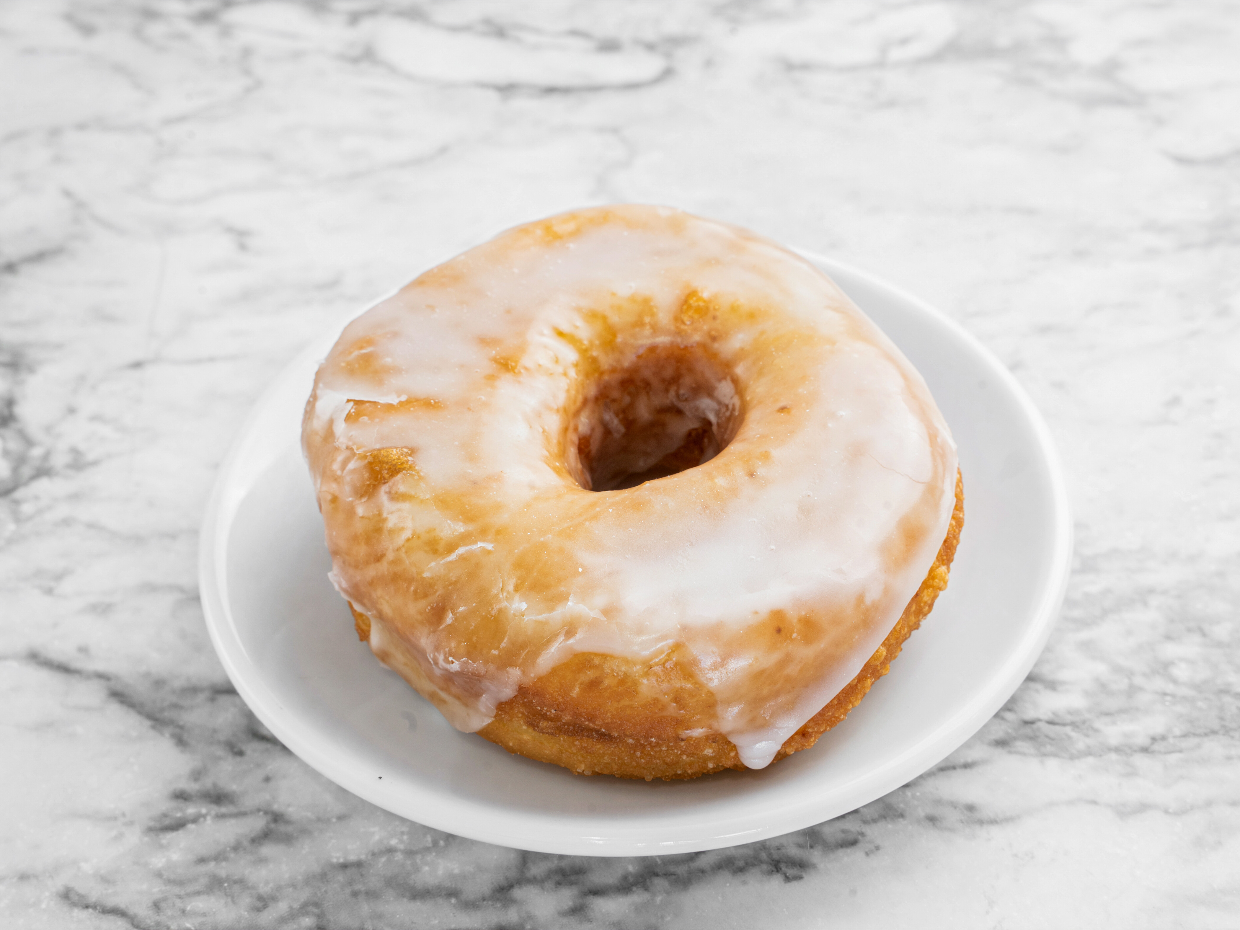 Order Vegan Vanilla Glaze Donut food online from Sugar Donuts store, Charlotte on bringmethat.com