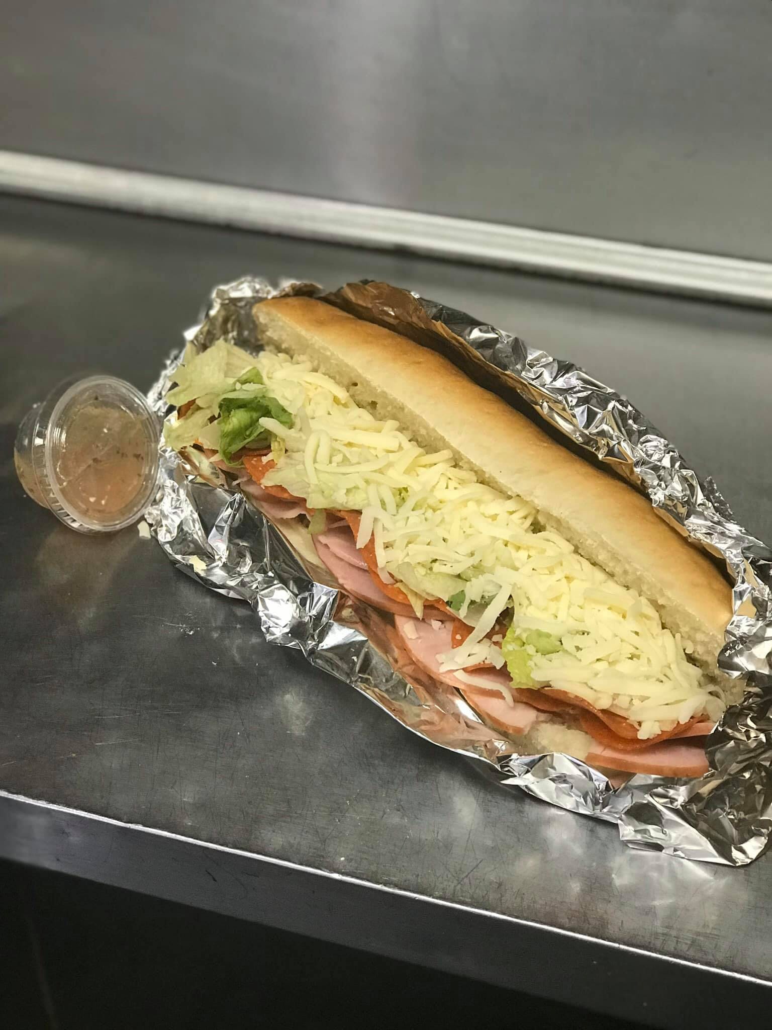 Order Ham & Cheese Sub - Sub food online from Reino's Pizza and Pasta store, Tiffin on bringmethat.com