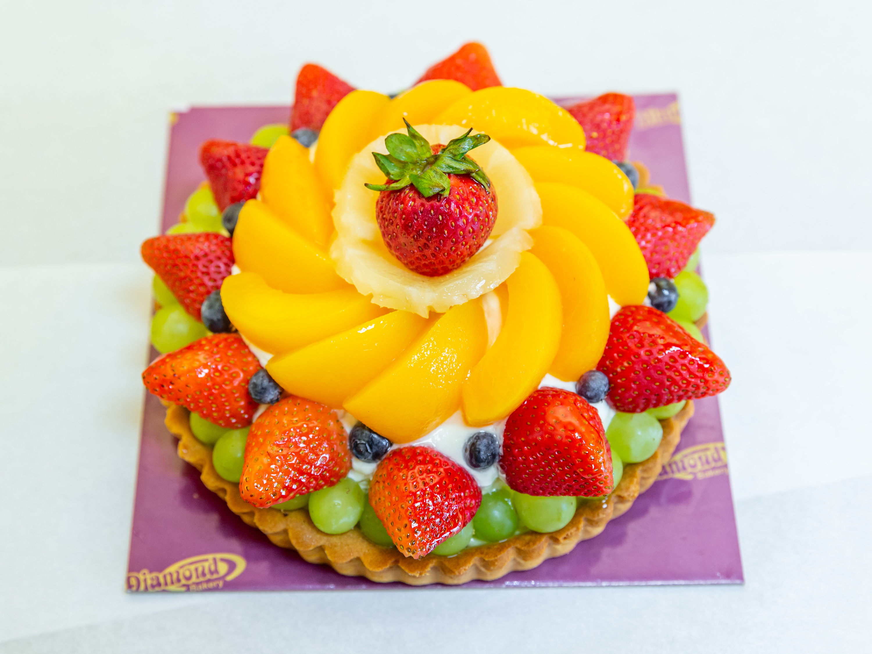Order 7" Fruit Tart food online from Diamond Bakery store, Monterey Park on bringmethat.com