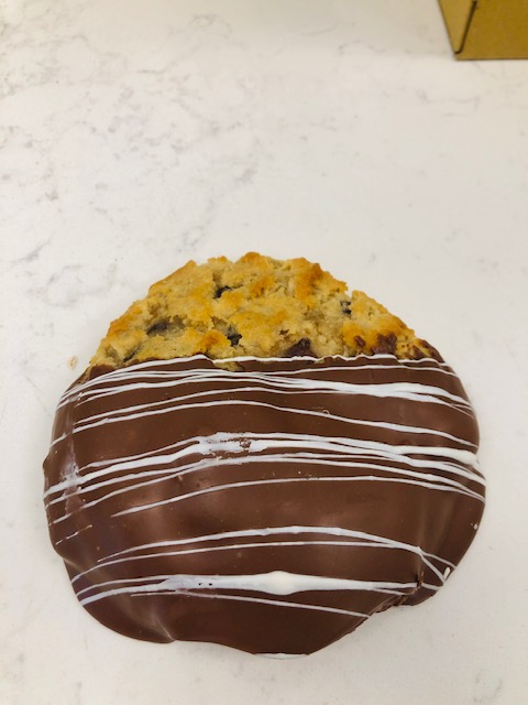 Order Chocolate Chip Cookie dipped in Milk Chocolate food online from Chocolate Wishes And Treats store, Clovis on bringmethat.com