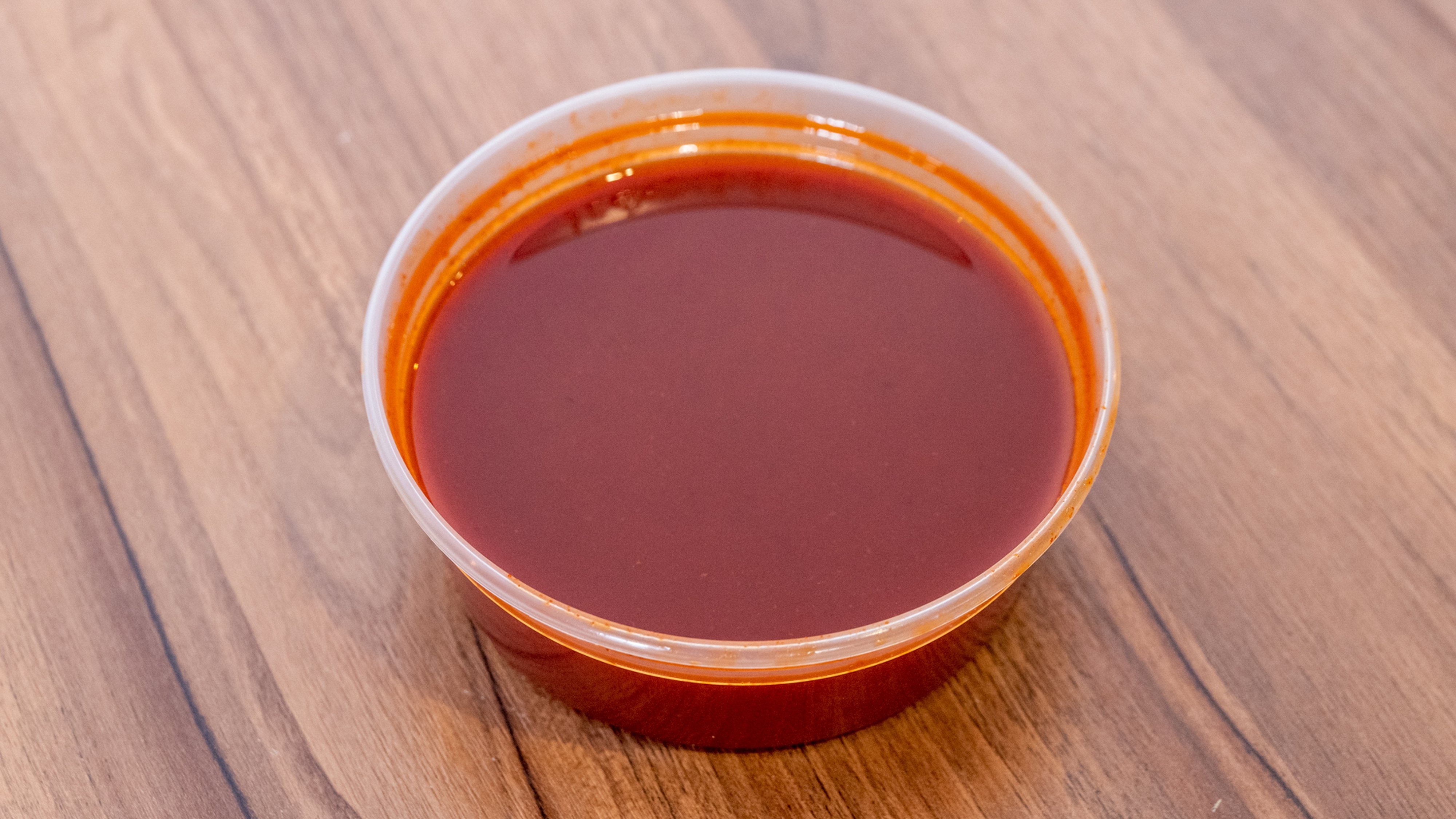 Order Side of Hot Sauce - 2 oz food online from Captain Jay Fish & Chicken store, Southfield on bringmethat.com