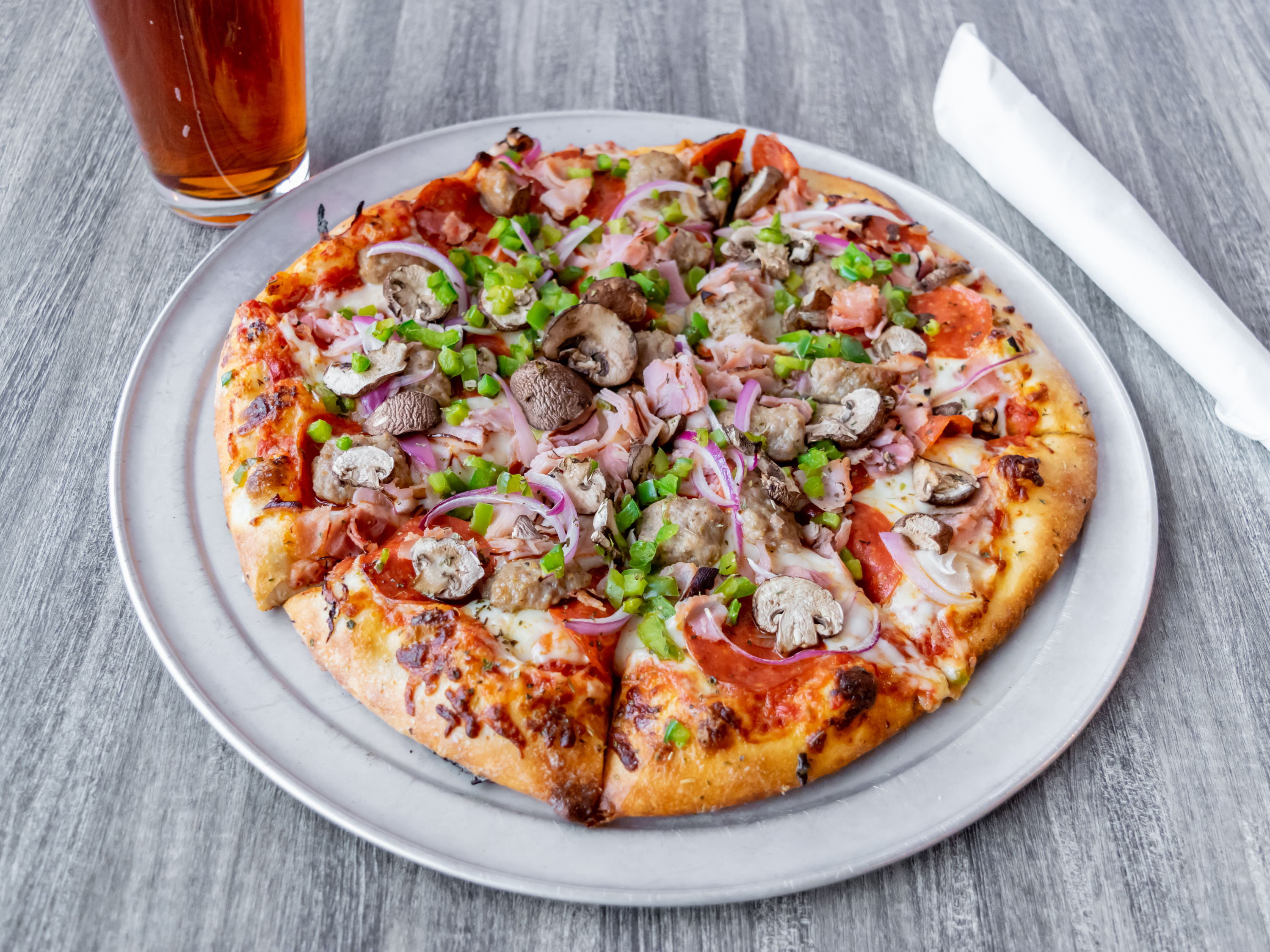 Order Deluxe Pizza food online from Bestside Bar & Grill store, Grand Rapids on bringmethat.com