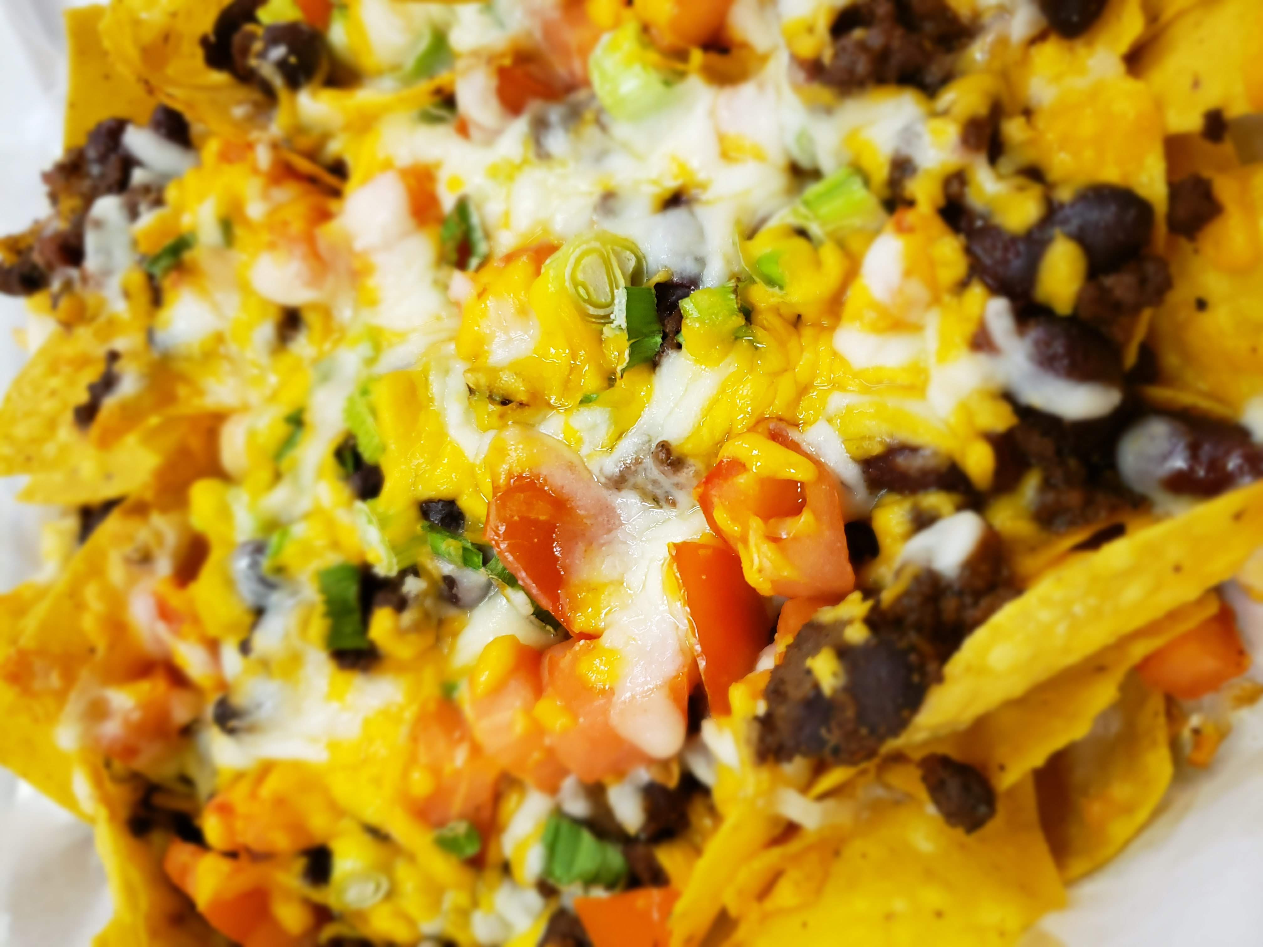 Order Loaded Nachos food online from Pineapple Jacks store, Rochester on bringmethat.com
