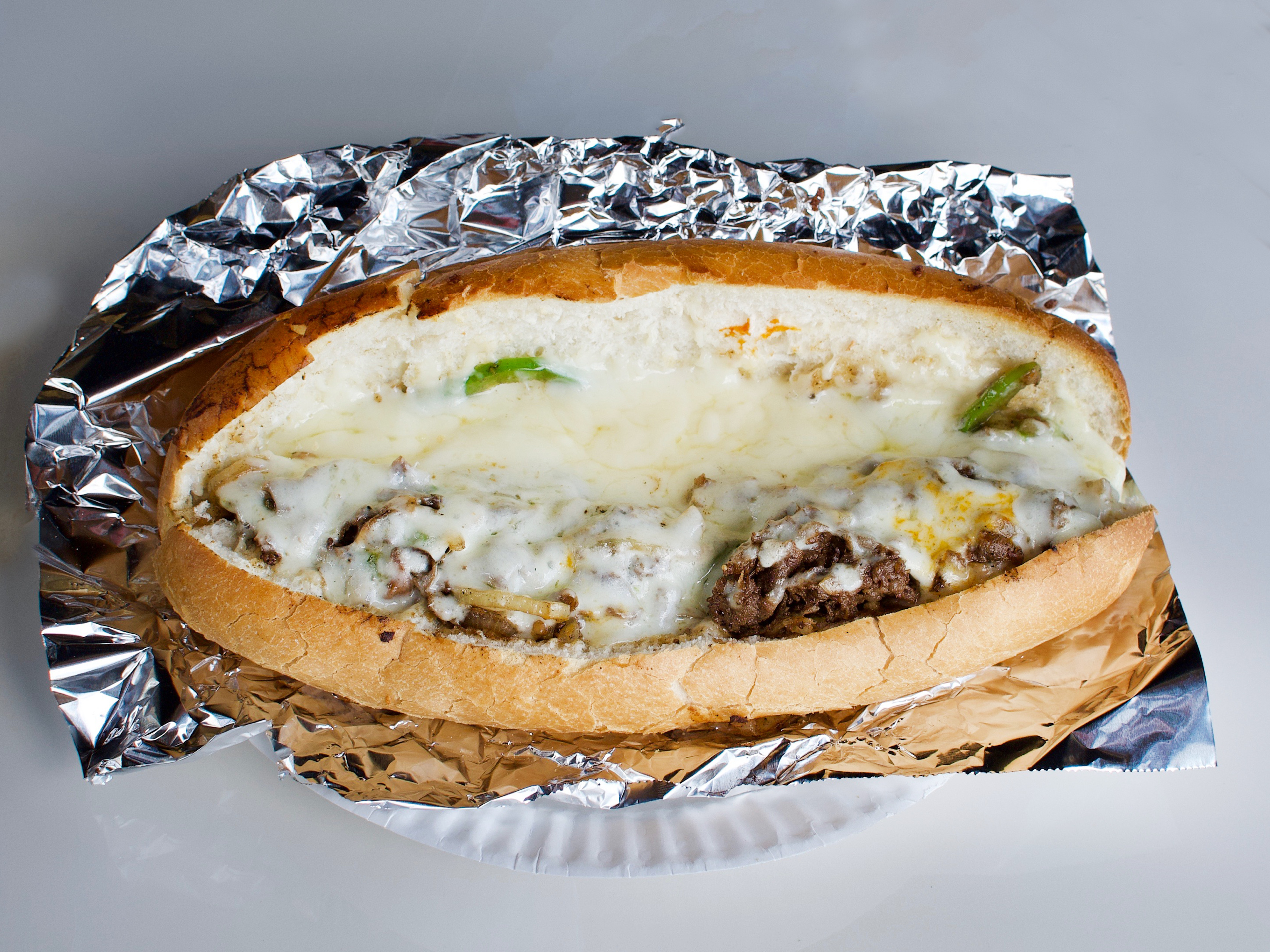 Order Philly Steak Sub food online from New Yorker Pizza store, Leesburg on bringmethat.com