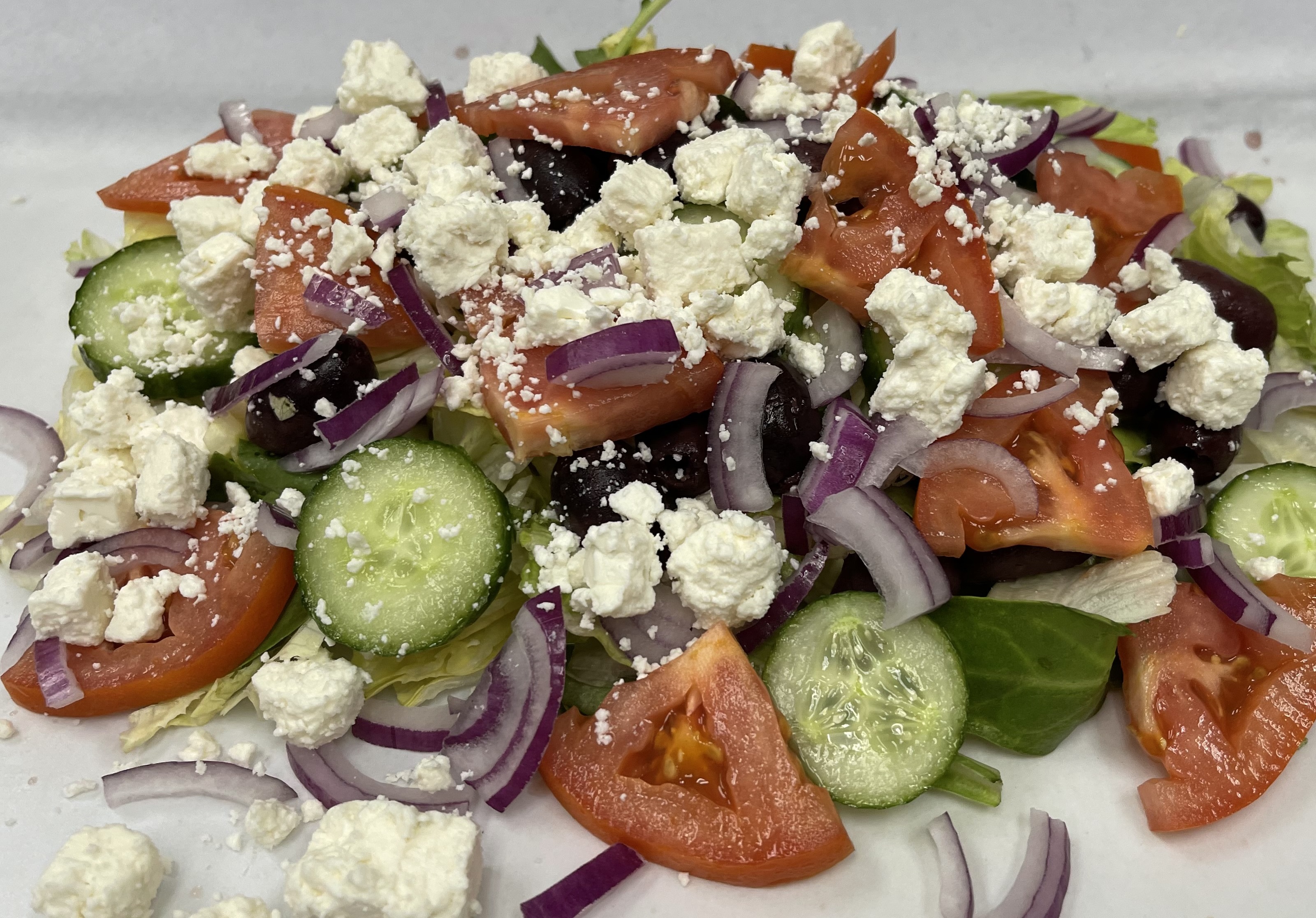 Order Regular Size Greek Salad food online from Ameci Pizza & Pasta store, Thousand Oaks on bringmethat.com