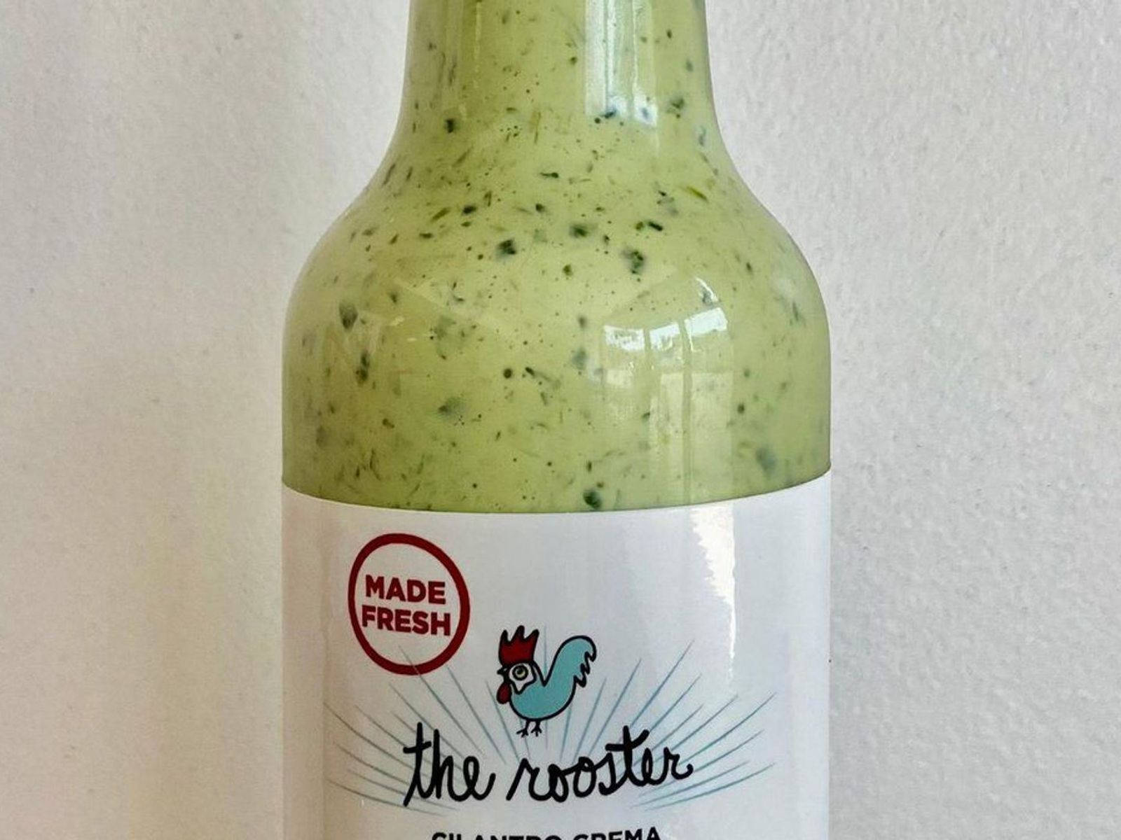 Order Green Sauce Bottle (Cilantro Crema) food online from The Rooster store, Los Angeles on bringmethat.com
