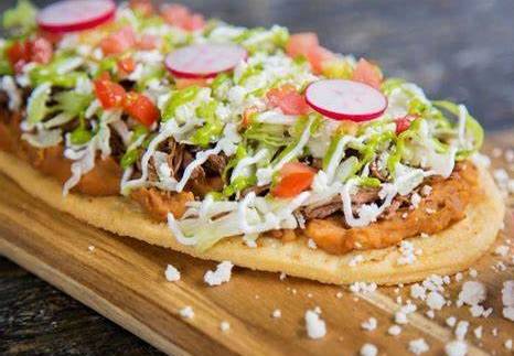 Order Huarache food online from Carlos Mexican Restaurant store, Westland on bringmethat.com