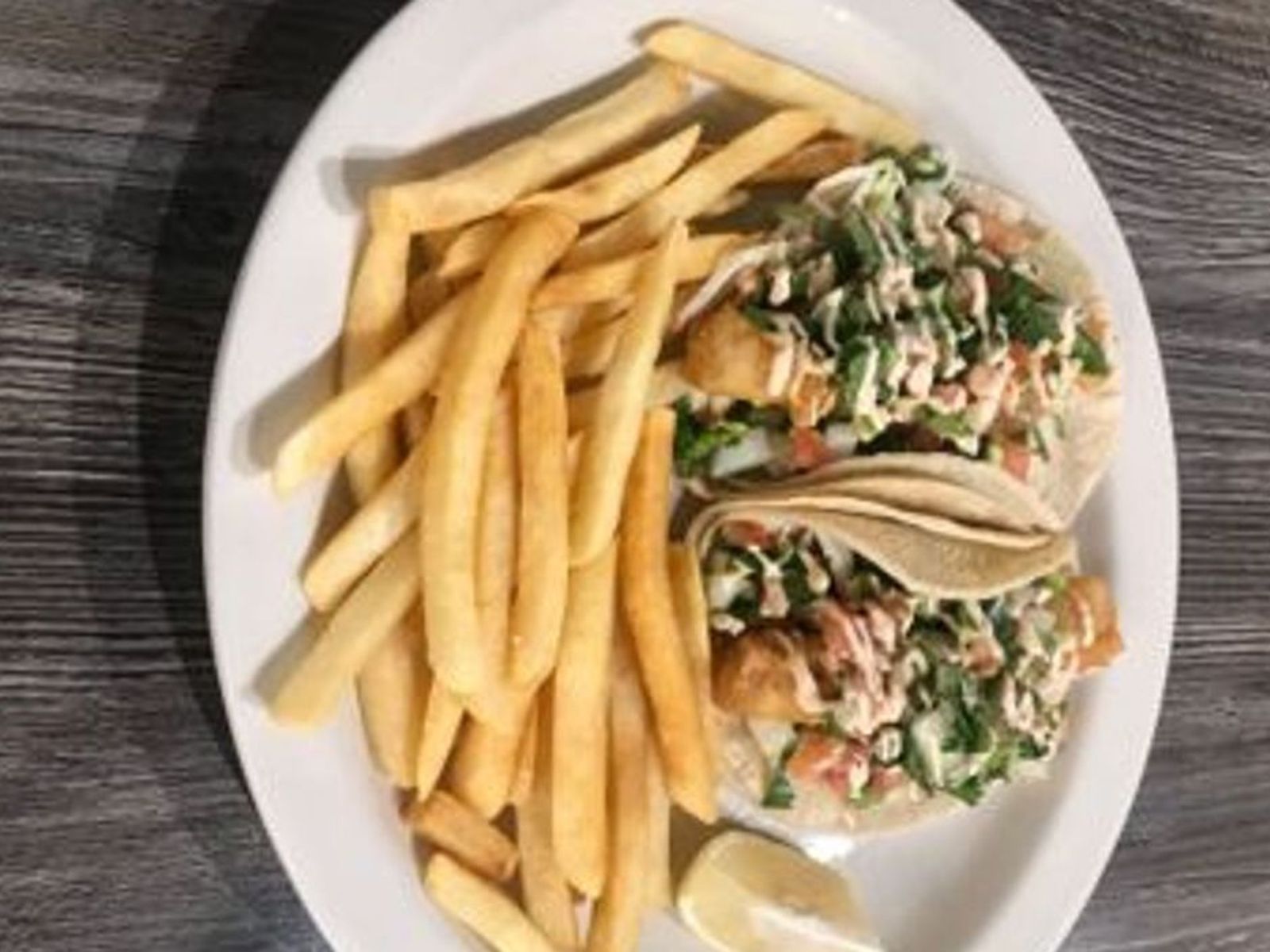 Order Baja Fish Tacos - OO food online from Biscuits Cafe store, Chandler on bringmethat.com