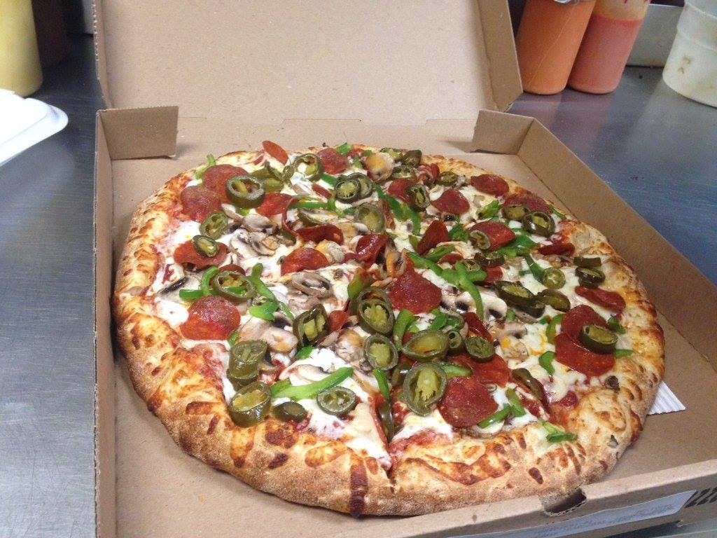 Order Deluxe Pizza - Small 10'' (4 Slices) food online from Star Pizza & Pasta store, Roswell on bringmethat.com