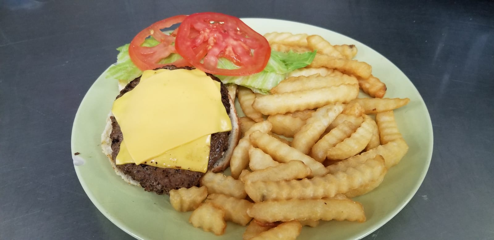 Order Cheese burger deluxe food online from Aminas Cafe store, Bronx on bringmethat.com