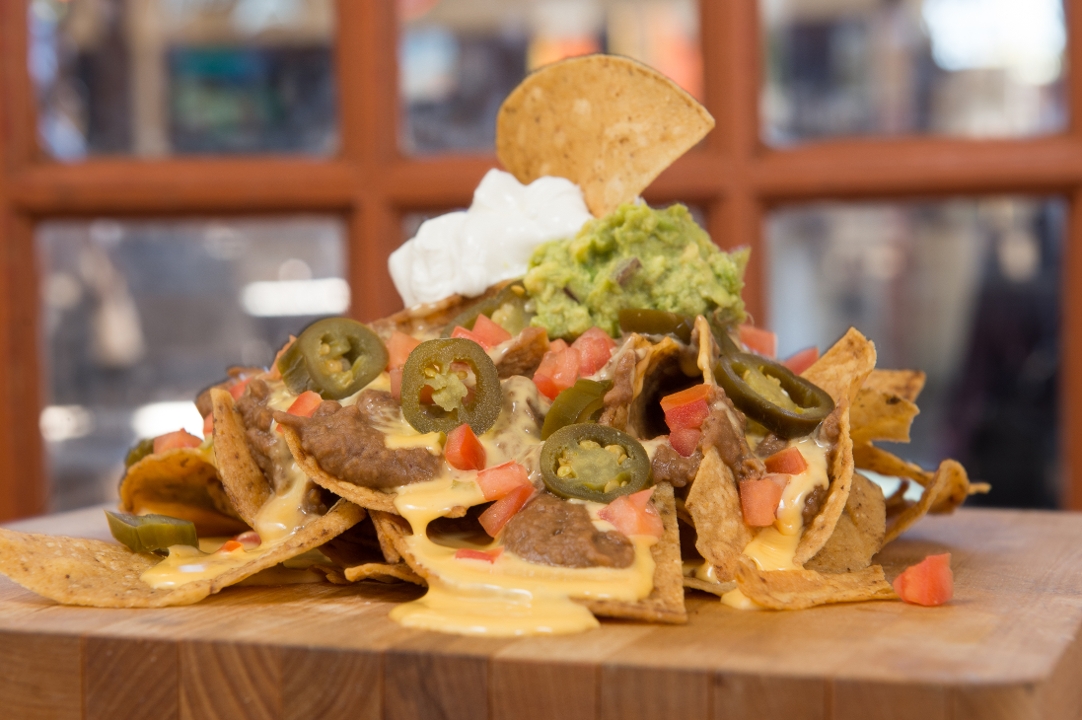 Order LOADED STACKED NACHOS food online from Tycoon Flats store, San Antonio on bringmethat.com