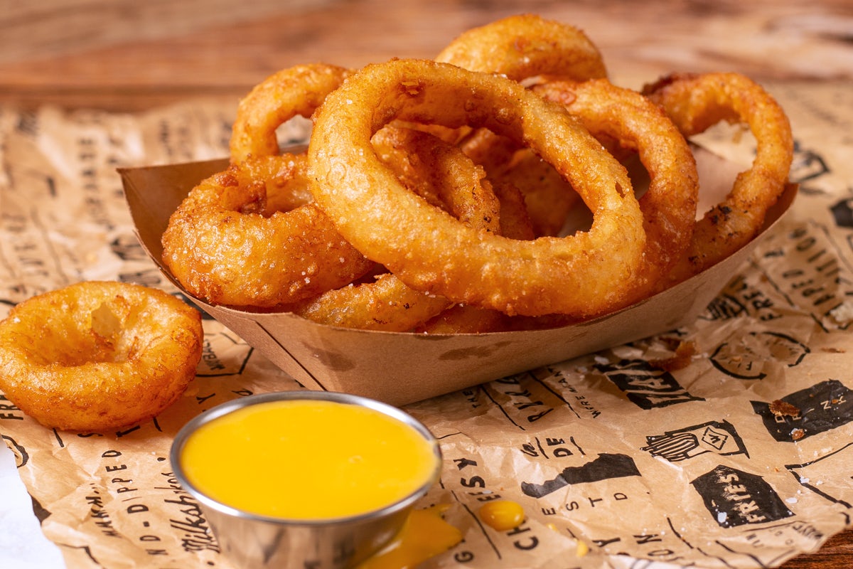 Order Onion Rings with Cheese Sauce food online from Wayback Burgers store, Lexington on bringmethat.com