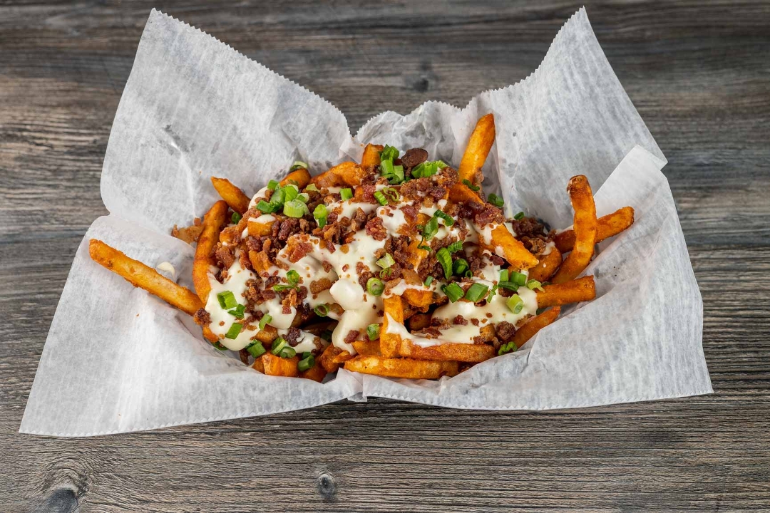 Order Loaded Queso Fries food online from High Tide Taco Bar store, Farmingdale on bringmethat.com