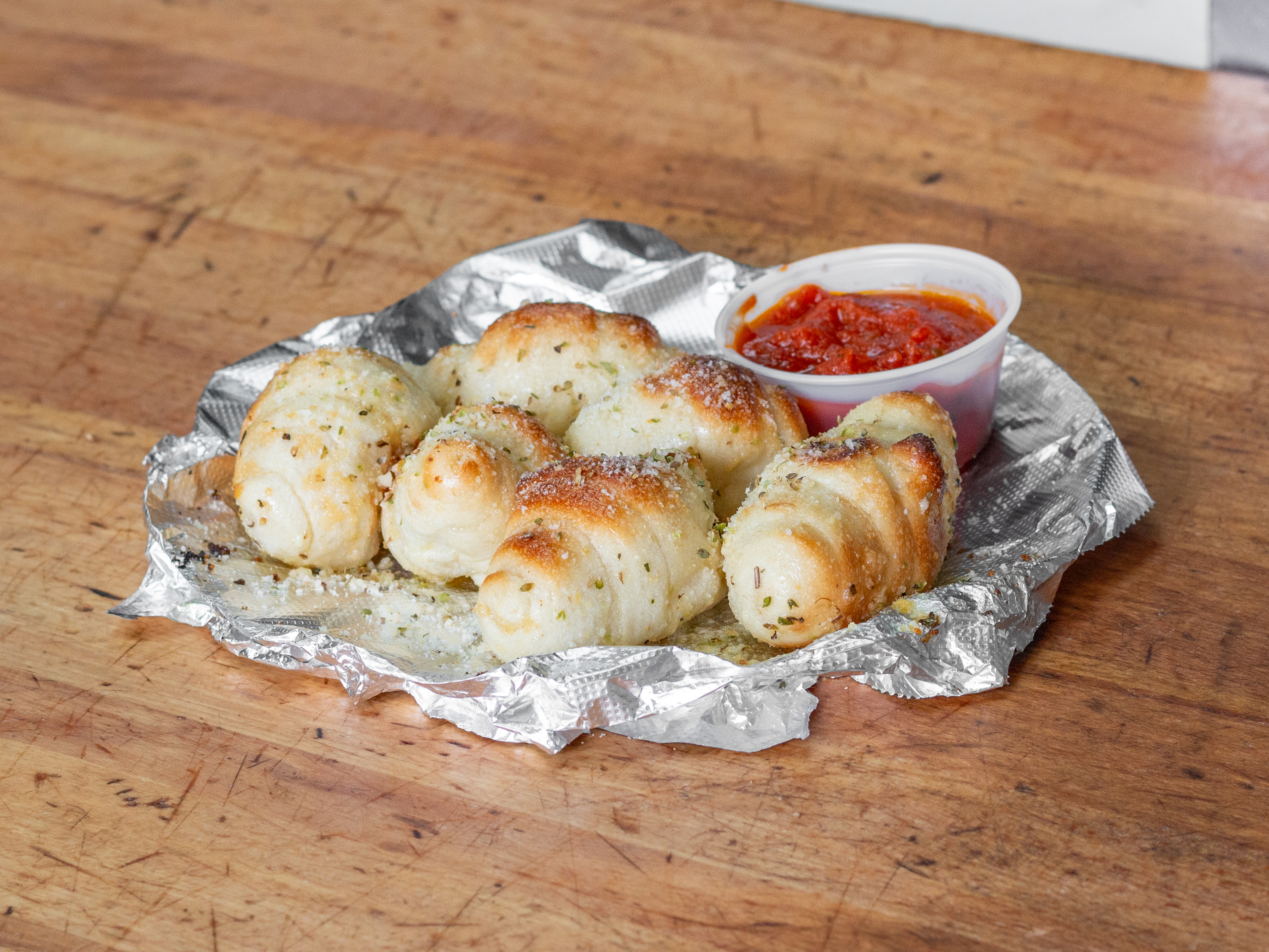 Order 6 Garlic Knots food online from Sicilian Pizzeria store, Schenectady on bringmethat.com