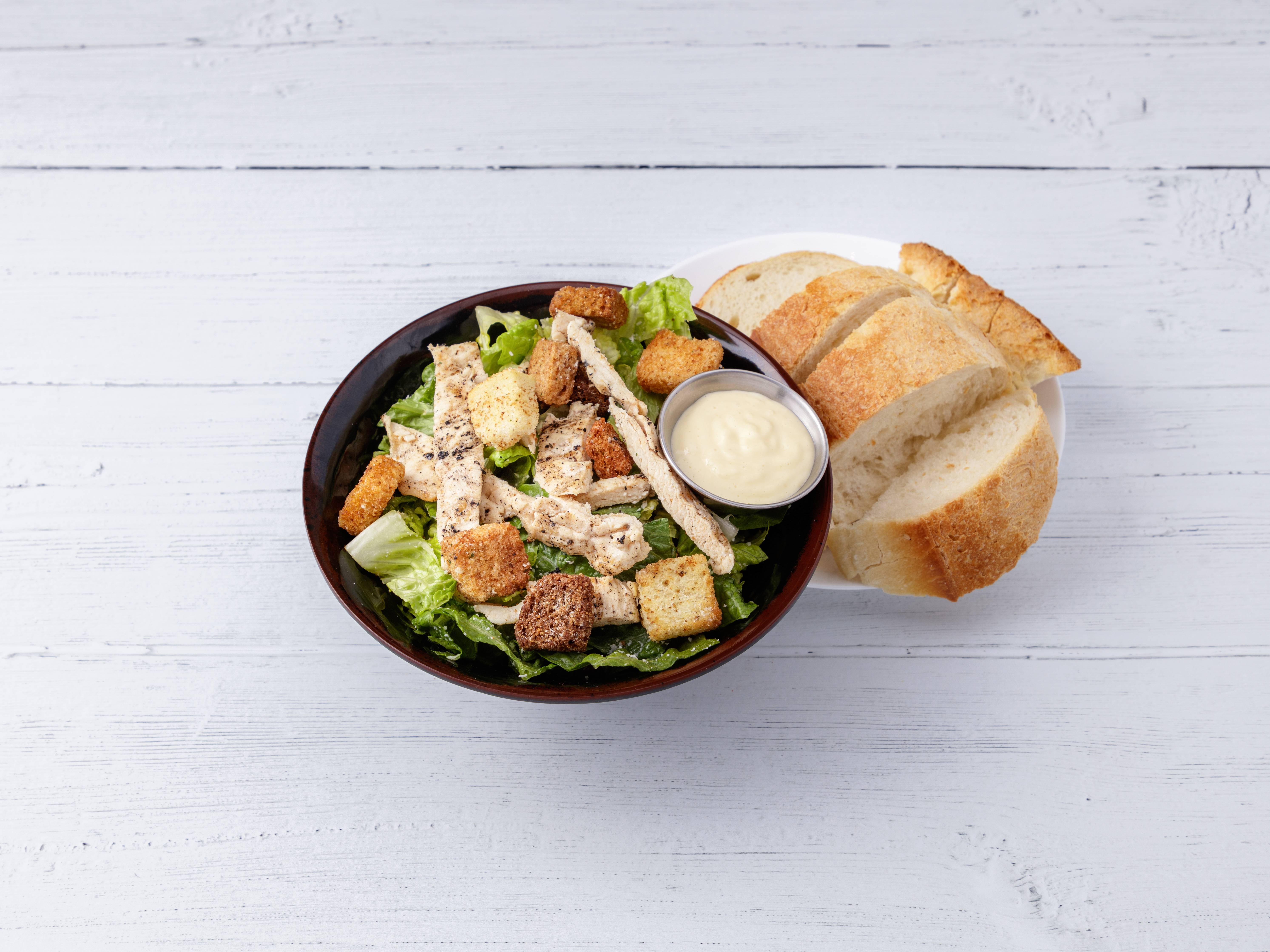 Order Caesar Salad with Grilled Chicken food online from Gino's Pizza and Luncheonette store, Belleville on bringmethat.com