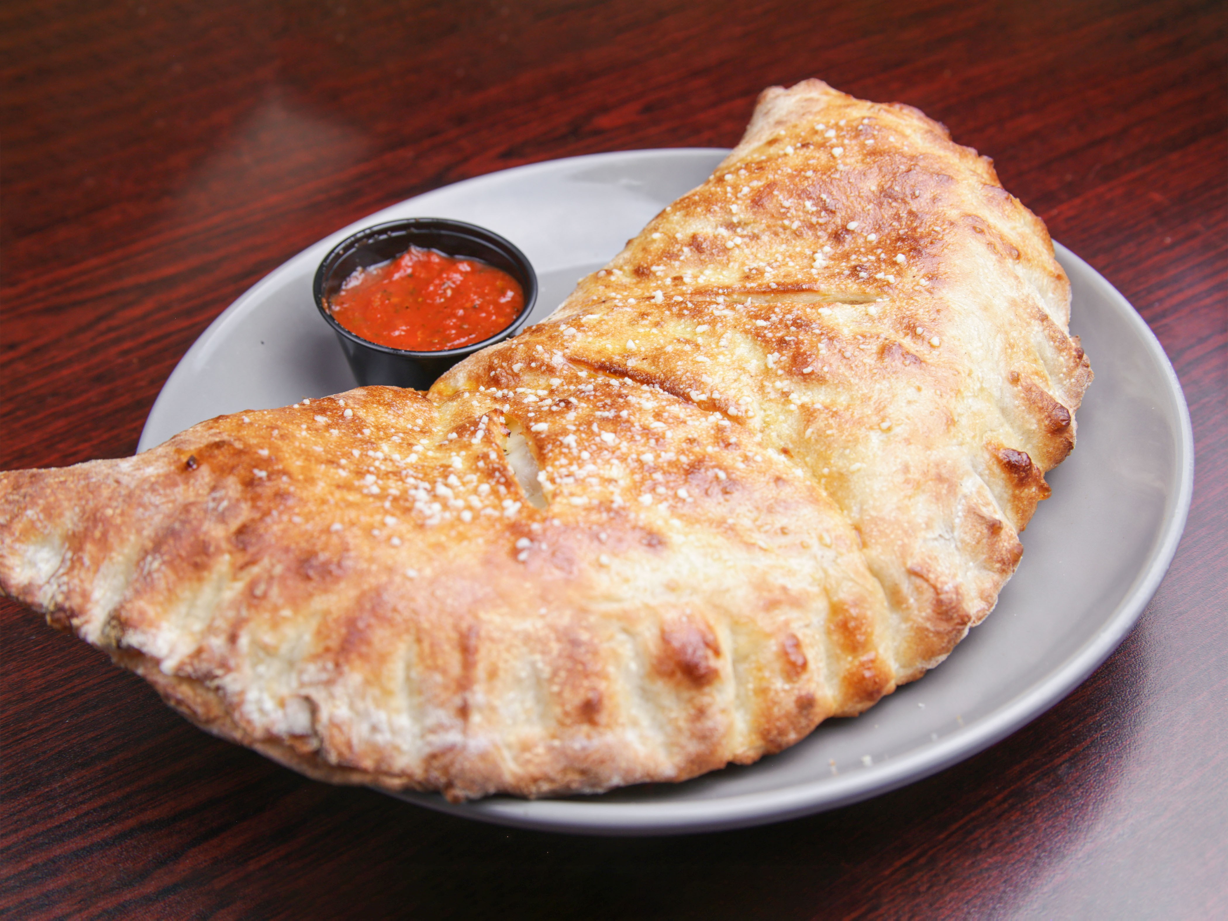Order Meat Deluxe Calzone food online from Rino D's Pizza & Wings store, Gilbert on bringmethat.com