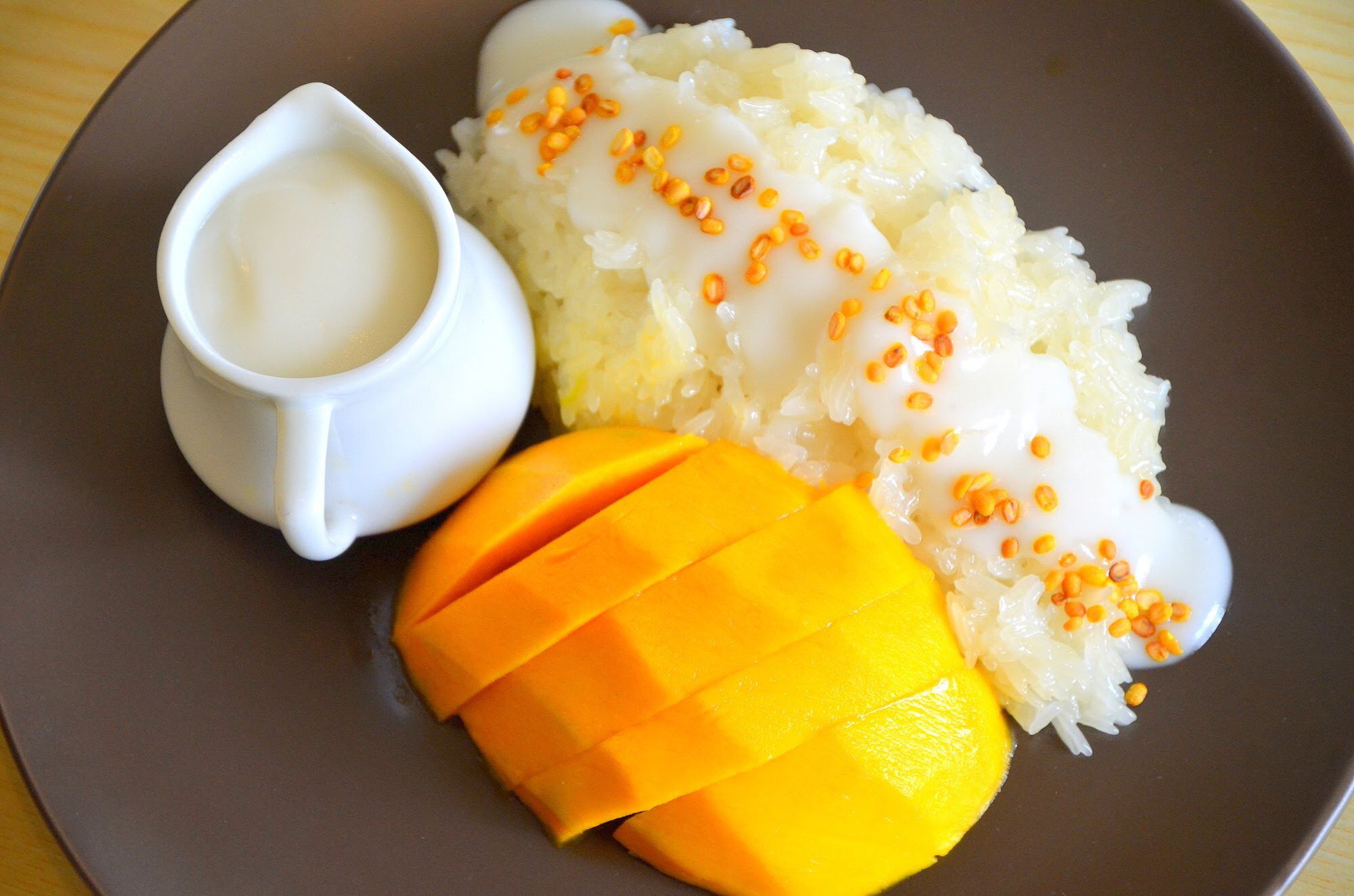 Order 27. Mango Sweet Sticky Rice food online from Uncle Chai Thailand Street Food store, San Diego on bringmethat.com