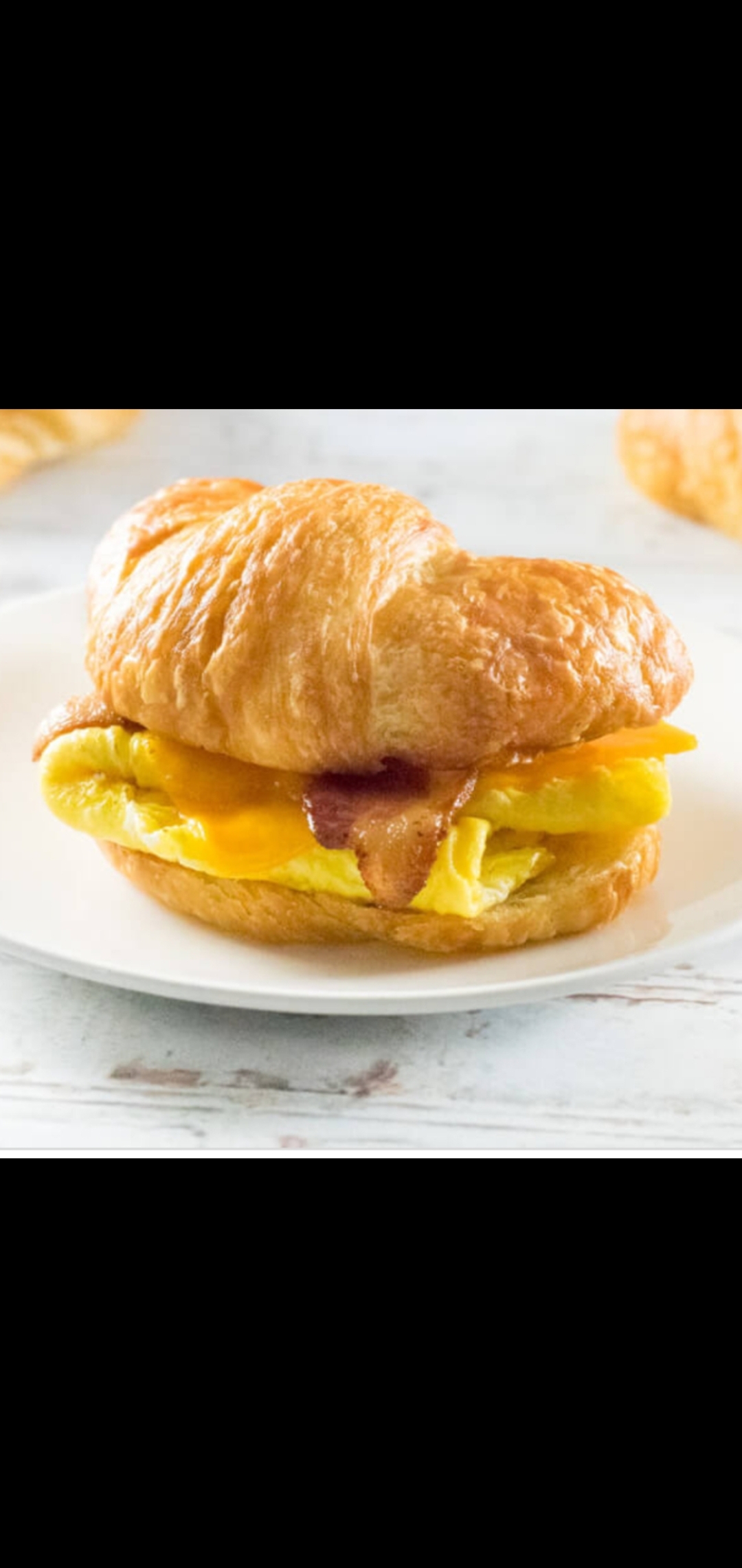 Order  Eggs And Cheese Croissant With Your Favorite Meat  food online from American Gourmet Foods Deli store, New York on bringmethat.com