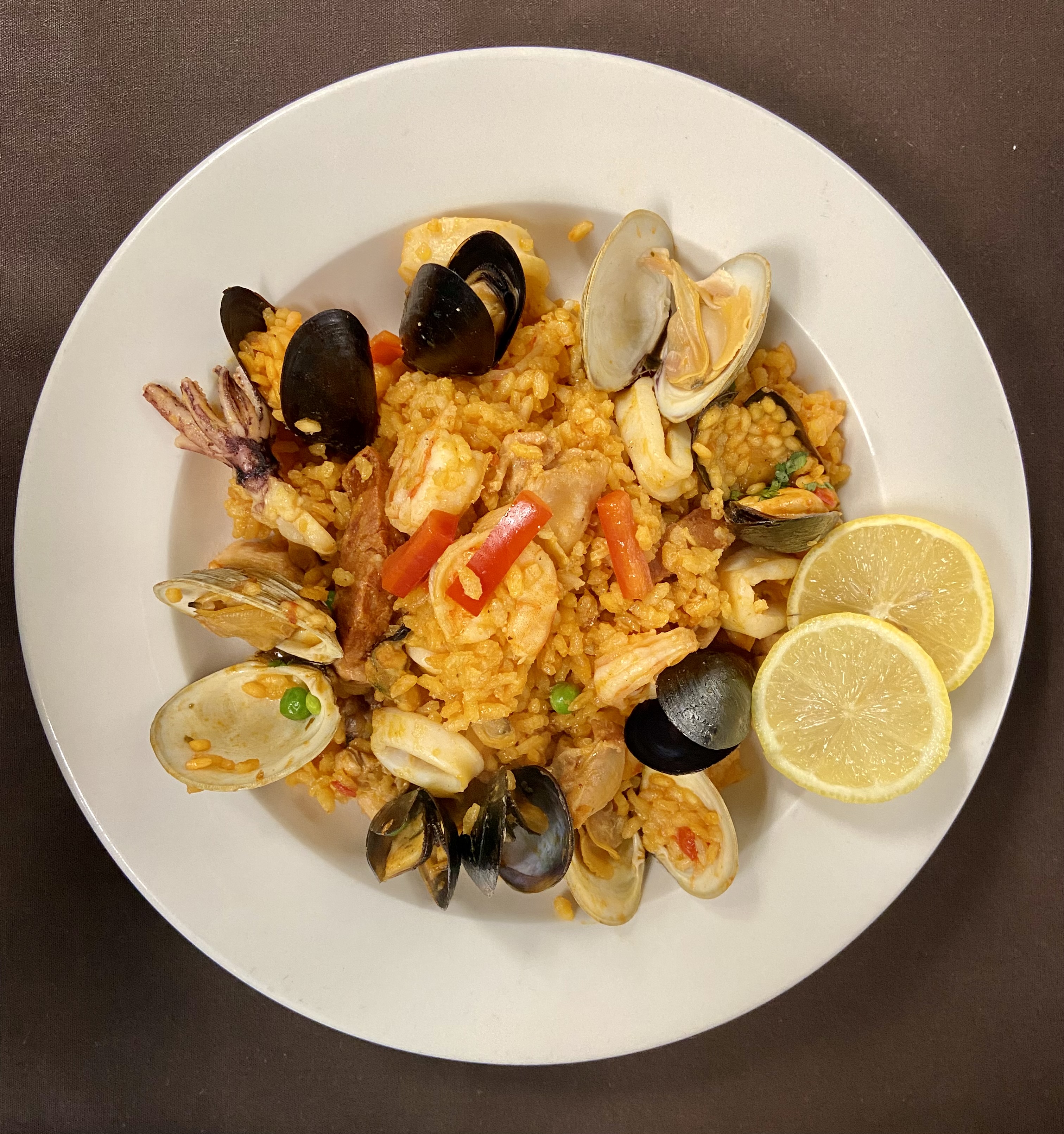 Order Paella Valenciana - NEW! food online from Mambo Empanadas store, Rutherford on bringmethat.com