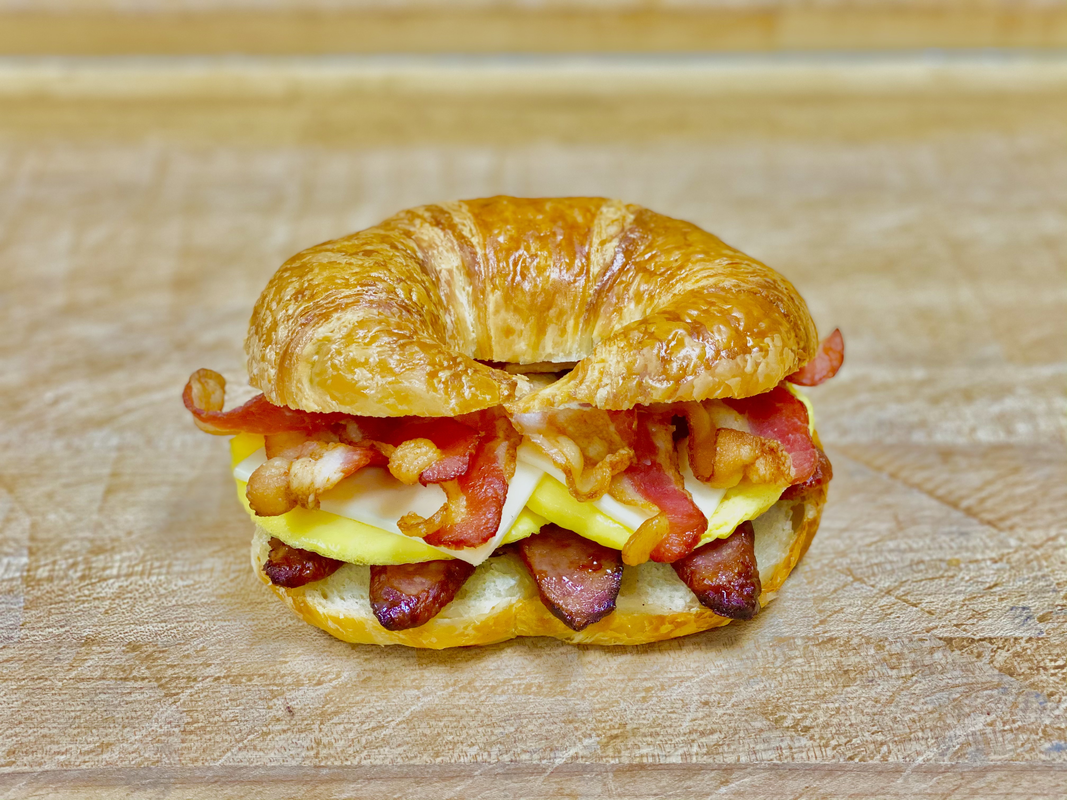 Order B-18 Sausage & Bacon & Egg & Cheese Croissant food online from K-Inn Donuts store, Paramount on bringmethat.com