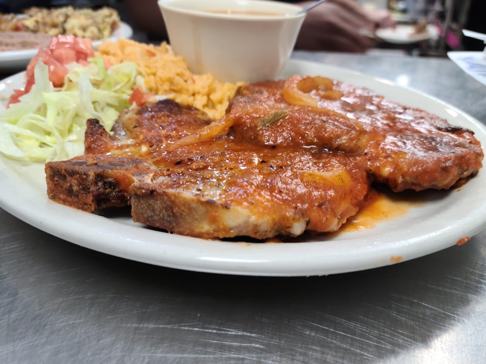 Order Pork Chop Ranchero food online from Los Arcos Mexican Grill store, San Antonio on bringmethat.com