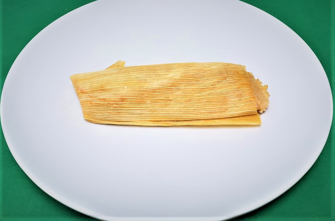 Order Red Chicken Tamal food online from 3 Aguilas Taqueria store, Denton on bringmethat.com
