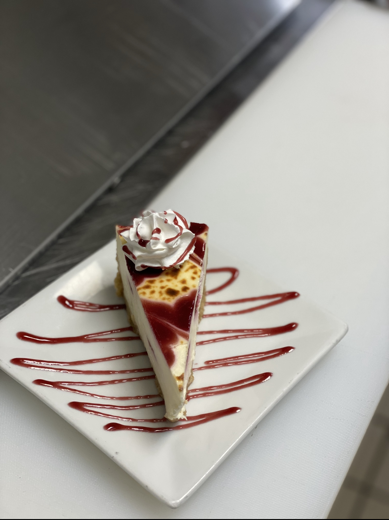 Order White Chocolate Raspberry Cheesecake food online from Antonio Restaurant & Winebar store, Chester on bringmethat.com