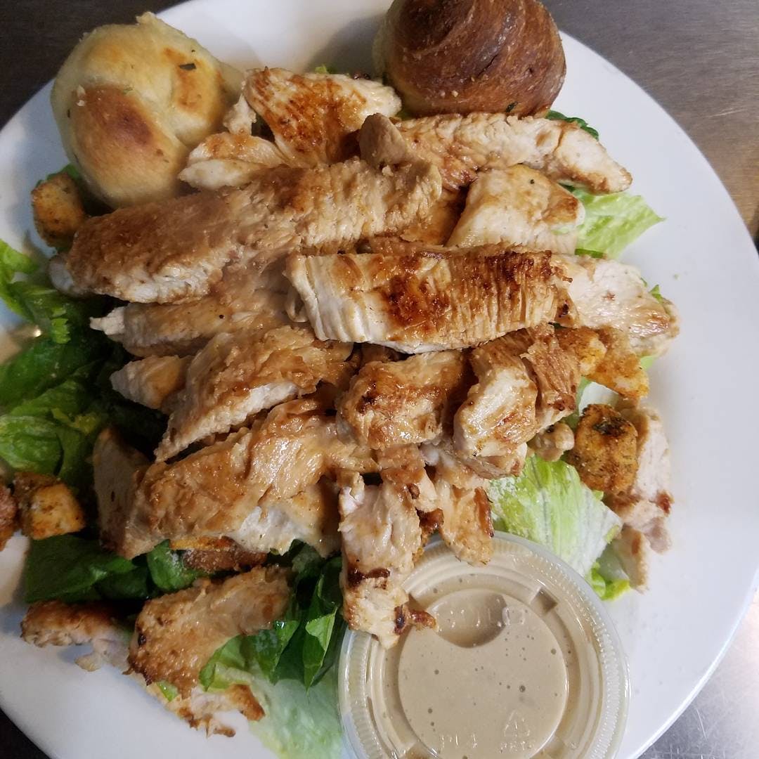 Order Grilled Chicken Caesar Salad - Small food online from Tony Sopranos Pizza store, Cherry Hill on bringmethat.com