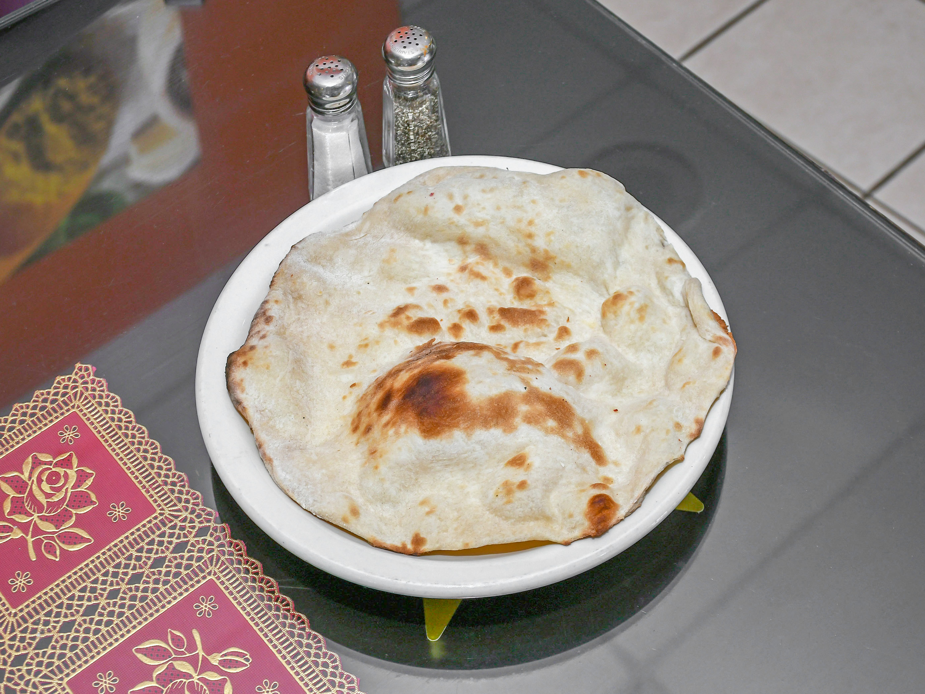 Order Naan food online from Spicepot Restaurants store, Urbandale on bringmethat.com