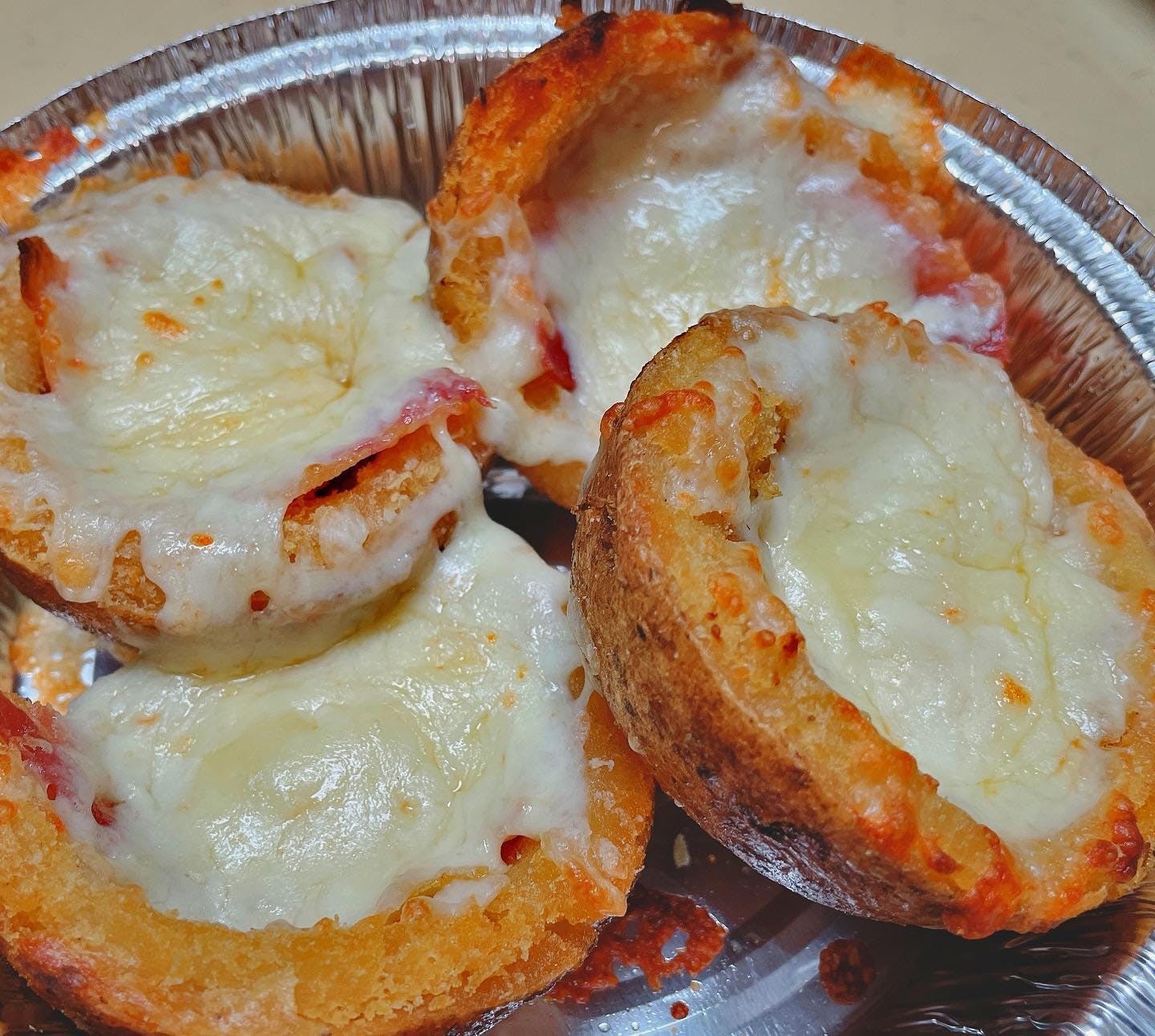 Order Potato Skins - 4 Pieces food online from Totis Pizza & Grill store, Pawtucket on bringmethat.com