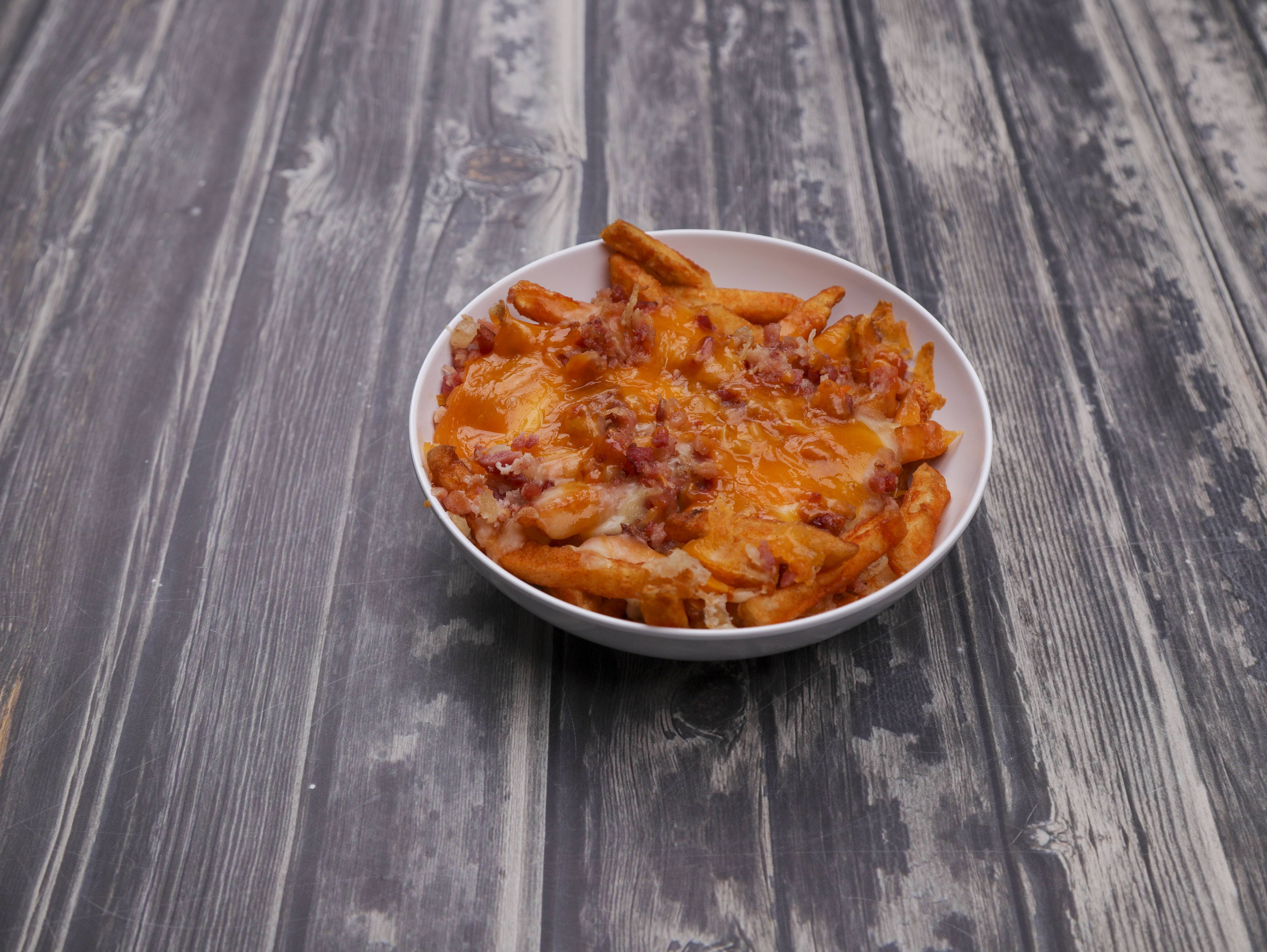 Order Bacon Cheddar Fries food online from Prides Deli and Pizzeria store, Beverly on bringmethat.com