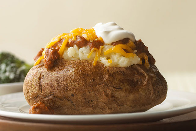 Order Chili and Cheese Baked Potato food online from Don & Millie store, Omaha on bringmethat.com