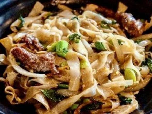 Order Drunken Noodle (Pad Kee Mao) ♨️♨️♨️ food online from Fire Bowl Cafe store, Austin on bringmethat.com