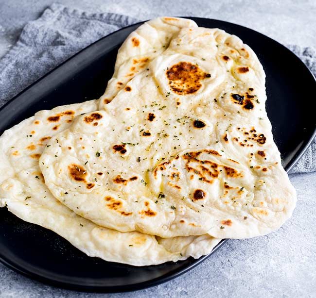 Order Butter Naan food online from Pb08 Indian Bistro & Bar store, Livermore on bringmethat.com
