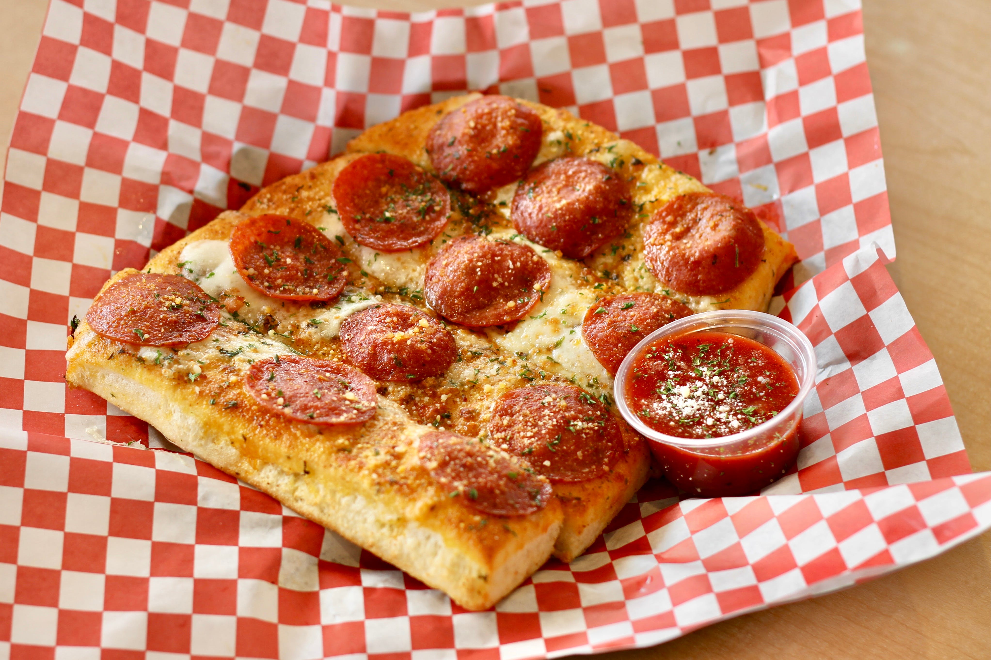 Order Garlic Bread with Melted Mozzarella & Pepperoni - 4 Pieces food online from California Pizza Place store, Anaheim on bringmethat.com