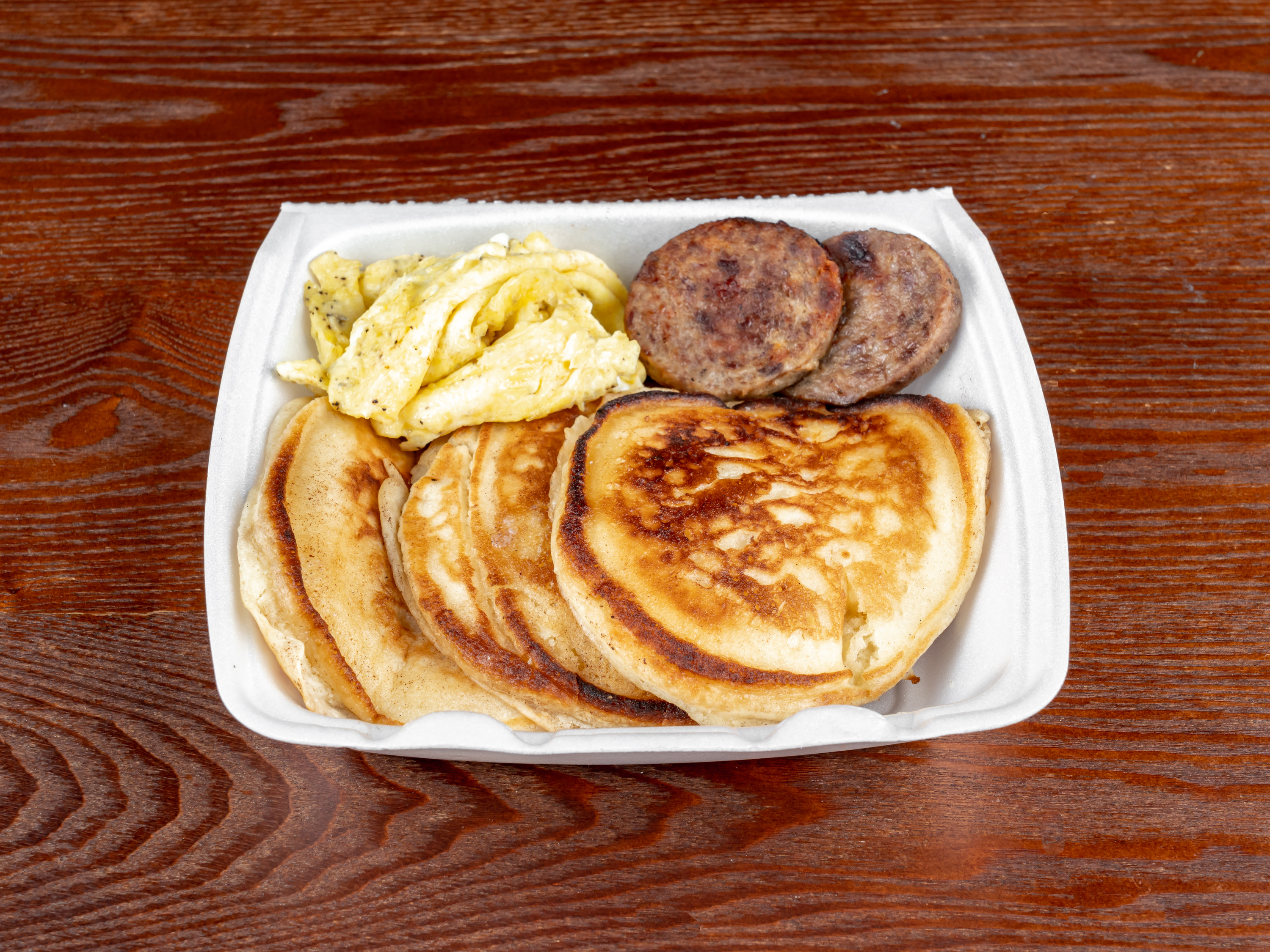 Order 3 Buttermilk Pancakes, 2 Eggs and 2 Sausage food online from Meraki Kitchen store, Houston on bringmethat.com