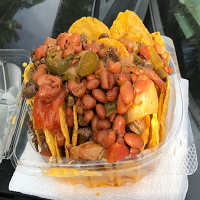 Order NACHOSE food online from El Gym Snack & Tacos store, Laredo on bringmethat.com