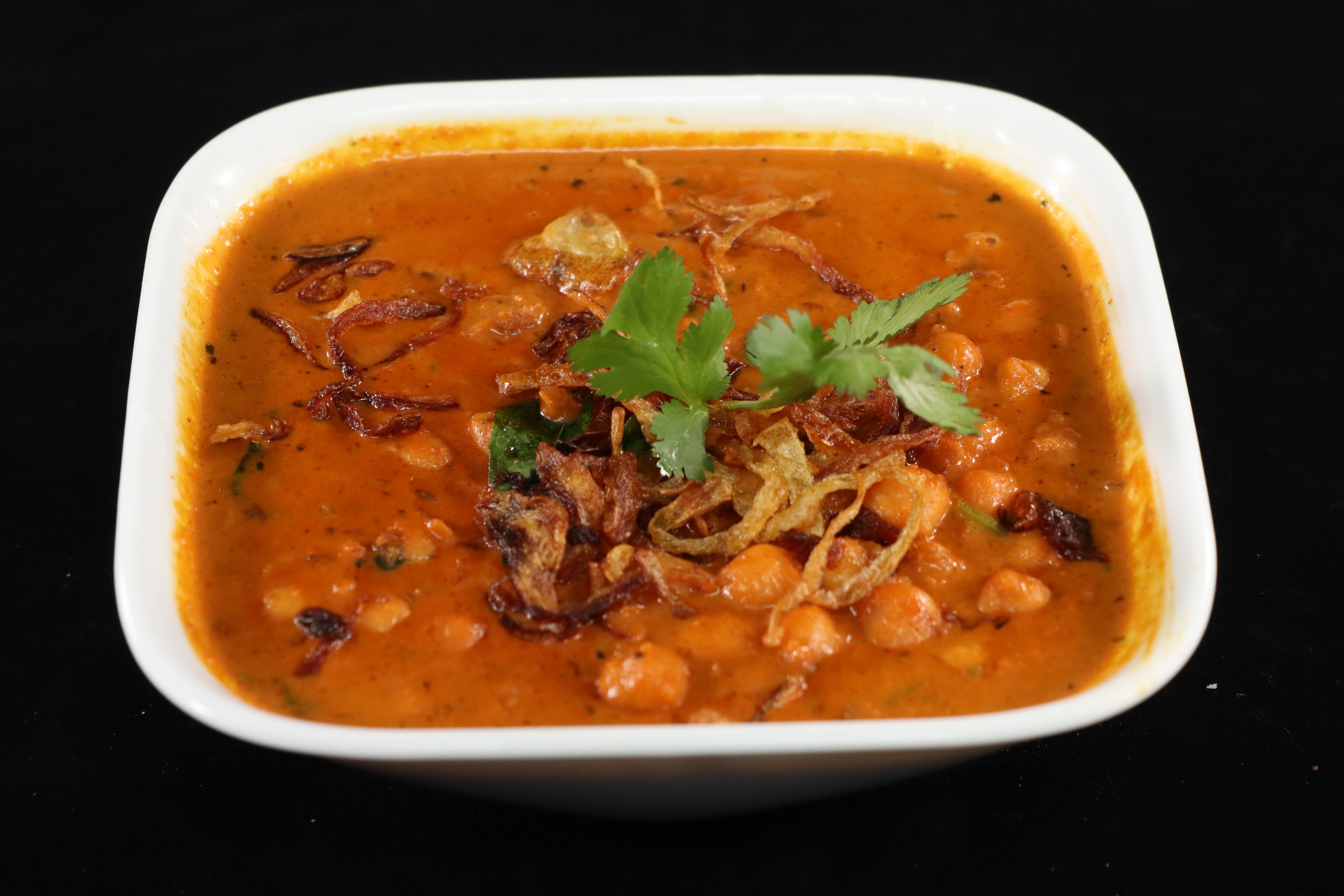Order Channa Masala food online from Biryani Hub store, Norfolk on bringmethat.com