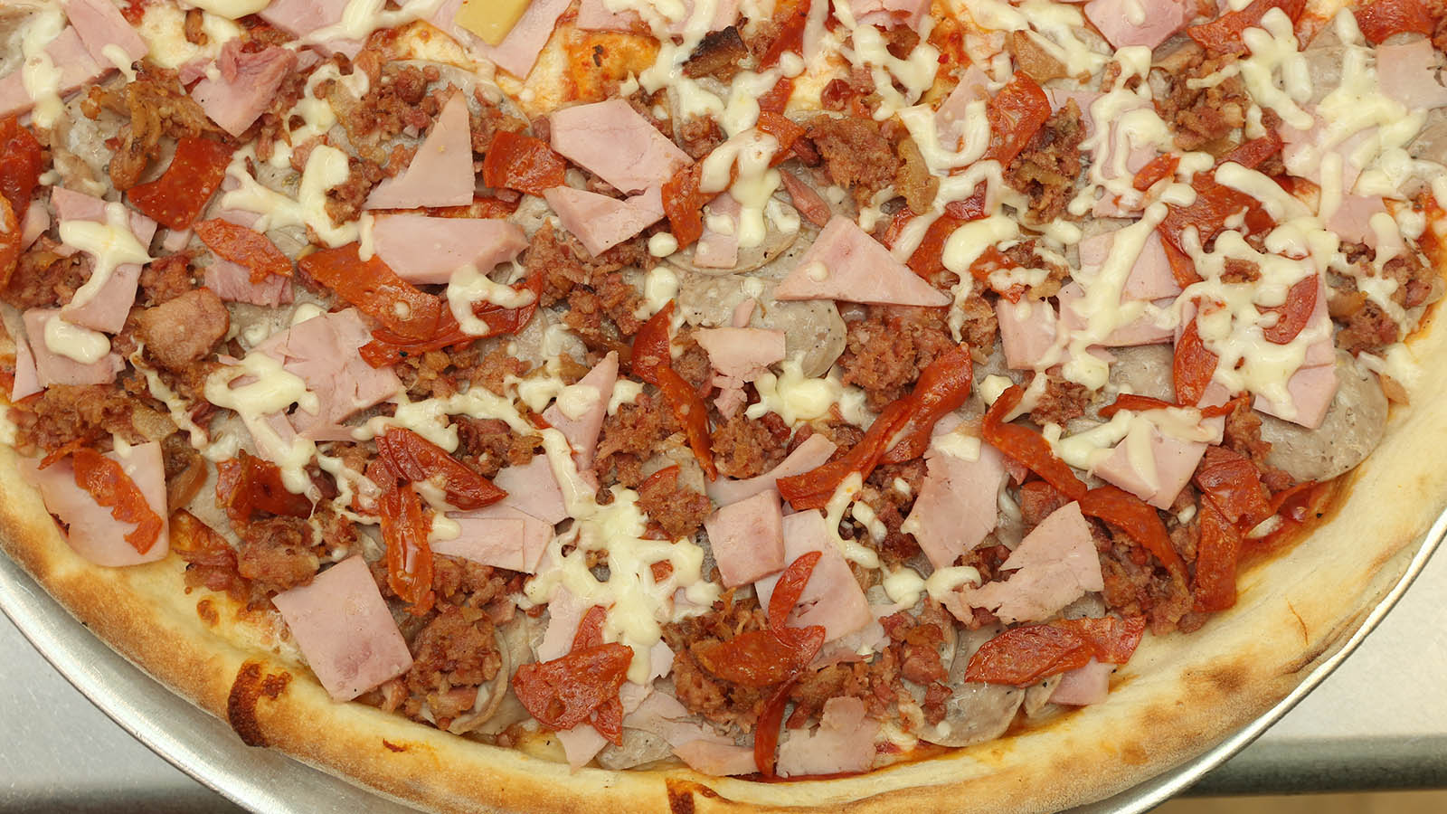Order Meat Lovers Slice food online from Joey Pepperoni's Pizza store, Bronx on bringmethat.com