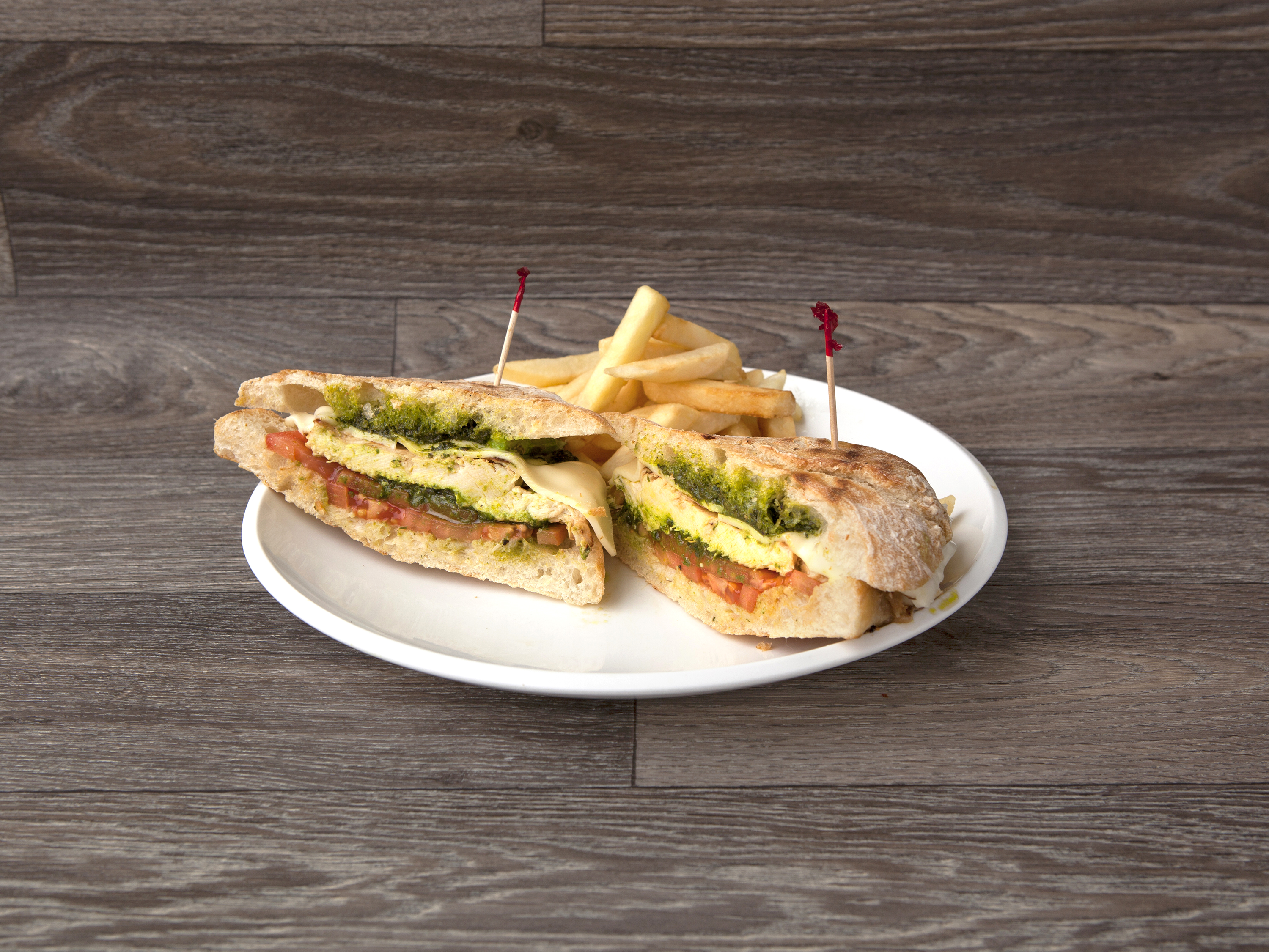 Order Grilled Chicken Pesto Panini   food online from Headlines Diner & Press Club store, Los Angeles on bringmethat.com