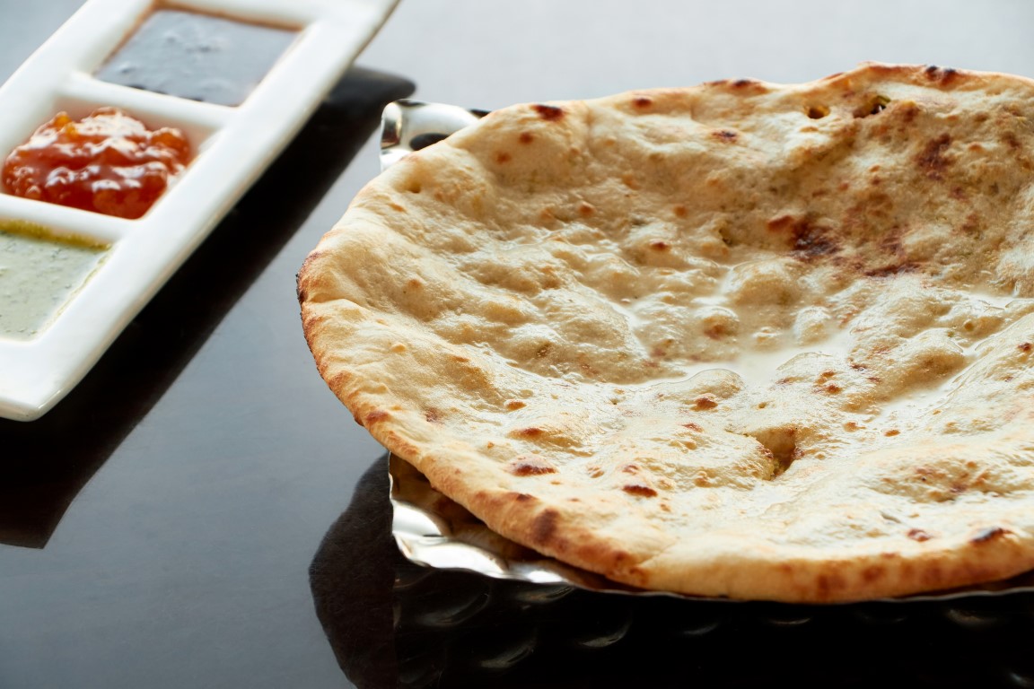 Order Peshawari Naan food online from Tiffin store, Elkins Park on bringmethat.com