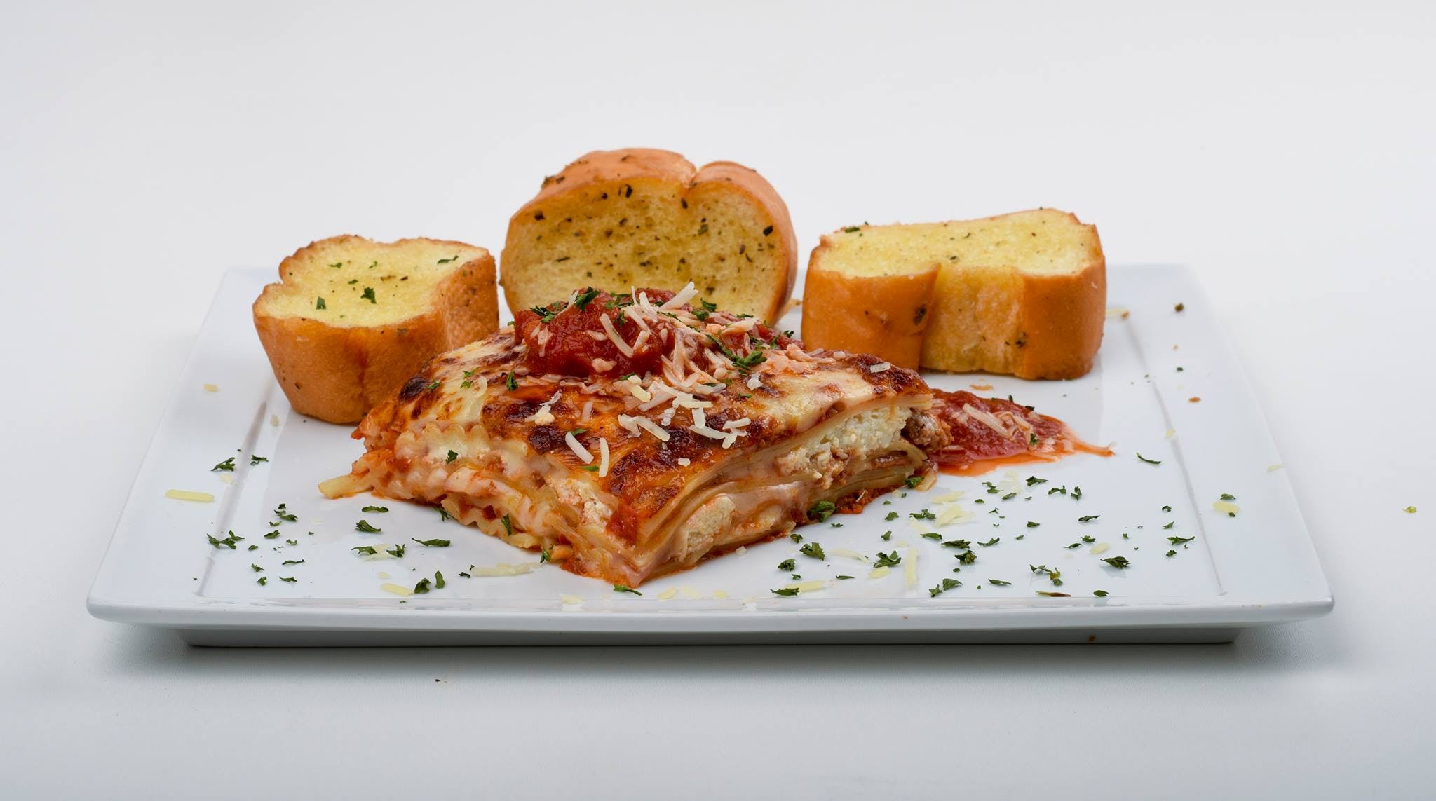 Order Homemade Meat Lasagna - Pasta food online from Paisano Pizza store, Vienna on bringmethat.com